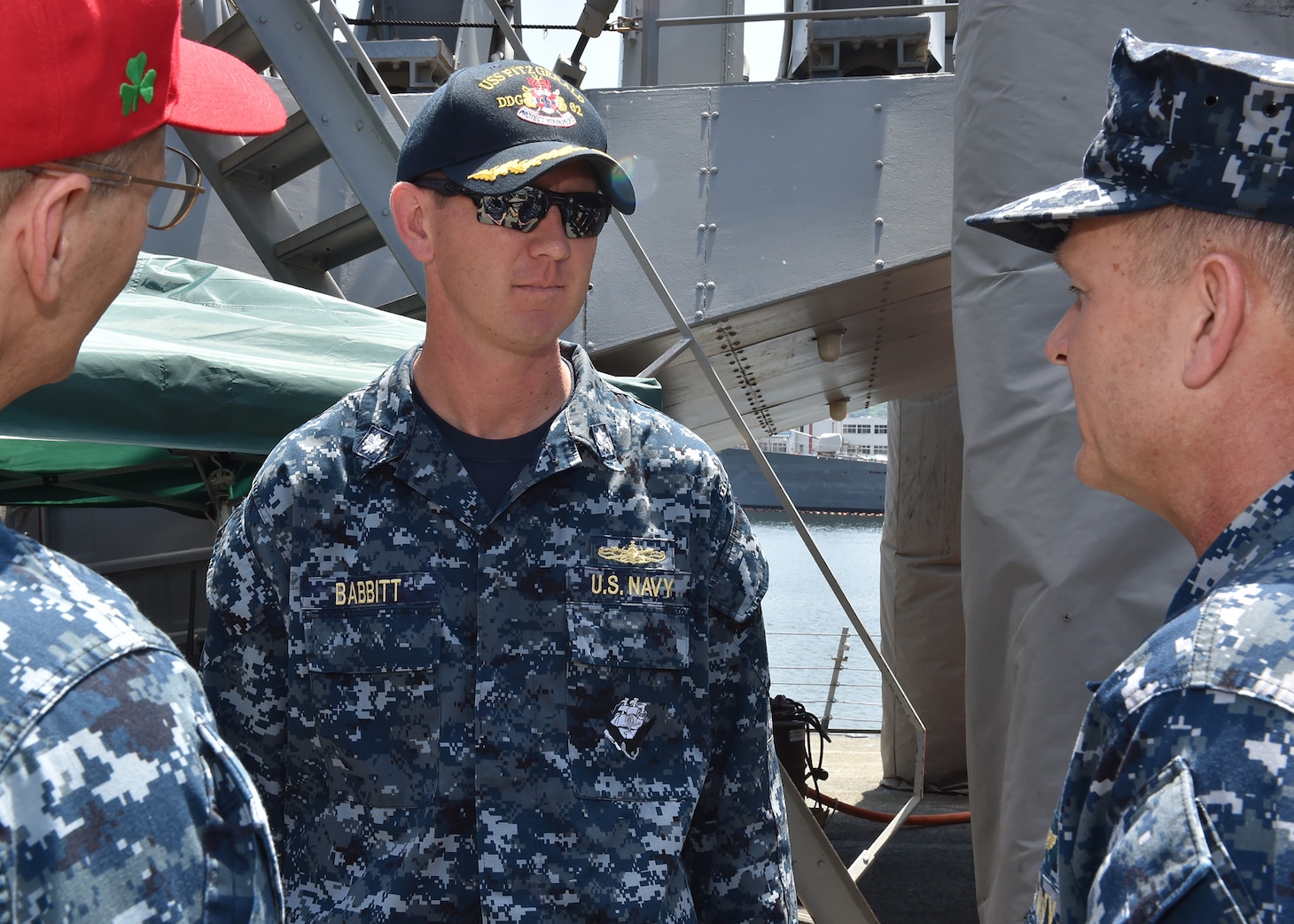 YOKOSUKA, Japan (June 19, 2017) Vice Adm. Joseph Aucoin, left, commander of U.S. 7th Fleet, and Rear Adm. Greg Fenton, right, commander of Naval Forces Japan/Navy Region Japan, speak to Cmdr. Sean Babbitt, executive officer of the guided-missile destroyer USS Fitzgerald (DDG 62). Babbitt temporarily took command of the ship after a collision with a merchant vessel June 17, 2017 when Fitzgerald's commanding officer was injured and medically evacuated. The ship suffered severe damage but returned to Fleet Activities Yokosuka under its own power. The incident is under investigation. U.S. Navy photo by (Mass Communication Specialist 2nd Class Richard L.J. Gourley/Released)