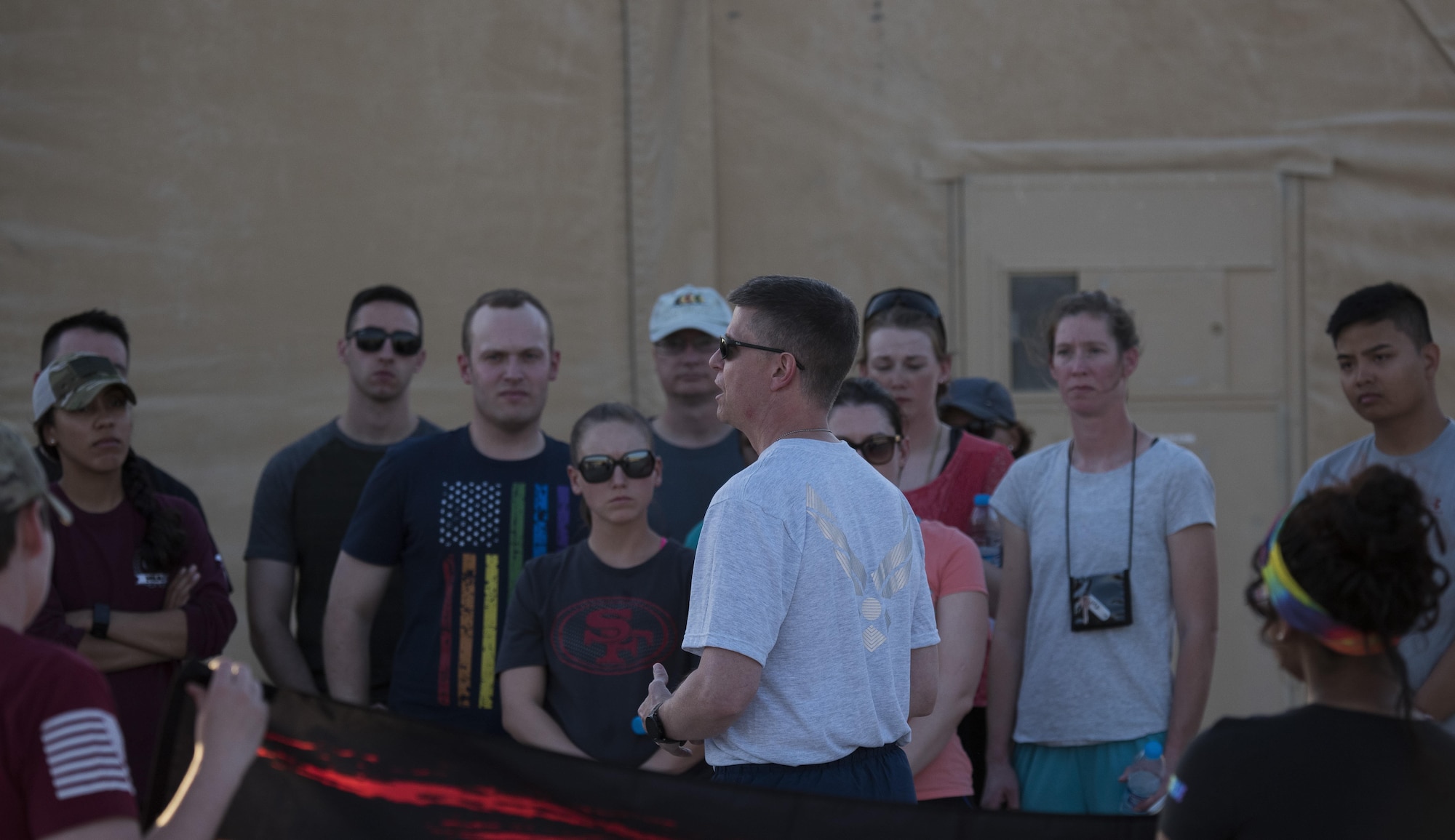 Brig. Gen. Kyle W. Robinson, 332nd Air Expeditionary Wing commander, gives opening remarks prior to a memorial walk June 12, 2017, in Southwest Asia. The walk commemorated those who lost their lives during the massacre at the Orlando Pulse nightclub. (U.S. Air Force photo/Senior Airman Damon Kasberg)
