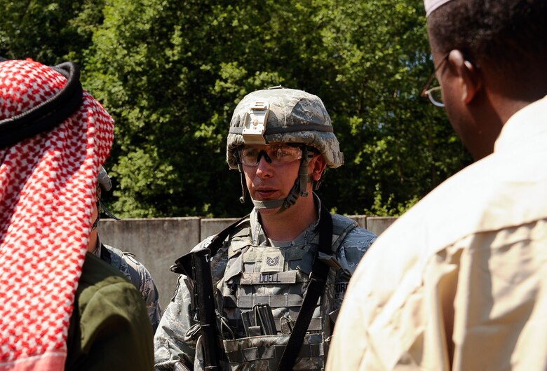 Tech. Sgt. Jacob Udell, 100th Security Forces Squadron flight sergeant speaks to a volunteer simulating a village elder during the 435th SFS’s Ground Combat Readiness Training Center Security Operations Course at U.S. Army Garrison Baumholder, Germany, June 15, 2017. Course volunteers acted as opposition forces to help the Airmen have realistic targets to not only engage, but also build rapport with, or speak to while conducting their missions. (U.S. Air Force photo by Airman 1st Class Savannah L. Waters)