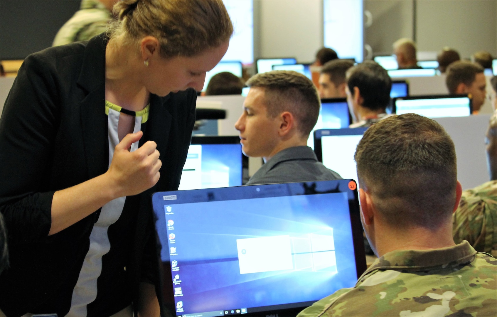 Austin Whisnant, a cyber exercise developer for the Cyber Workforce Development Team at Carnegie Mellon University, assists a Solider on day one of the Cyber X-Games, hosted by the Army Reserve Cyber Operations Group (ARCOG), 335th Signal Command (Theater), June 15, 2017, at Carnegie-Mellon University in Pittsburgh. Cyber X-Games is a five-day exercise focusing on advanced areas of cyber security training. 