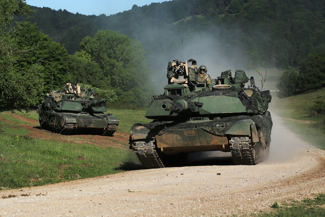 Soldiers maneuver a M1A2 Abrams tanks  during exercise Combined Resolve VIII at the Hohenfels Training Area, Germany, June 9, 2017. The soldiers are assigned to the 4th Infantry Division’s Company A, 166th Armored Regiment. Exercise Combined Resolve VIII is a multinational exercise designed to train the Army’s regionally allocated forces to the U.S. European Command and includes more than 3,400 participants from 10 nations. Army photo by Spc. Gage Hull