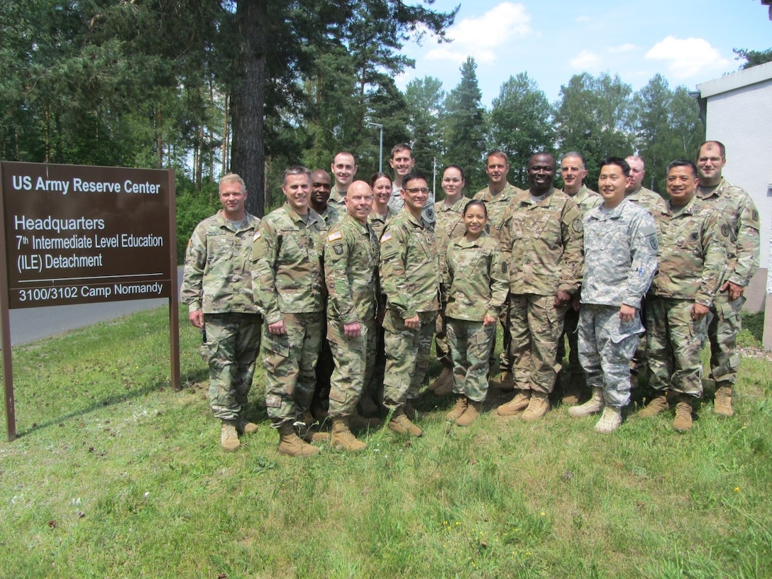 A group of the 42 U.S. Army field grade officers from various U.S.  Army commands and components pose after completing the Command and General Staff Officer Course, Common Core Course Phase III at Camp Normandy, United States Army Garrison, Bavaria on June 17, 2017. 