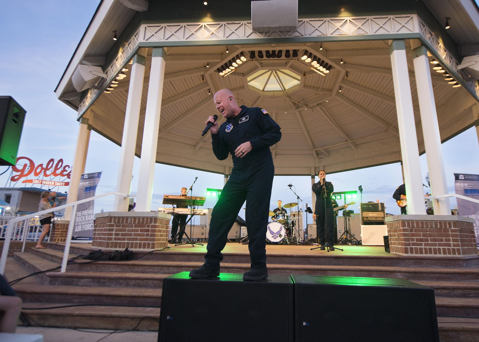 Senior Master Sgt. Ryan Carson, Max Impact vocalist and superintendent, sings during a concert June 17, 2017, at the Rehoboth Beach Bandstand, in Rehoboth Beach, Del. Max Impact is stationed out of Joint Base Anacostia-Bolling in Washington, D.C. (U.S. Air Force photo by Senior Airman Zachary Cacicia)