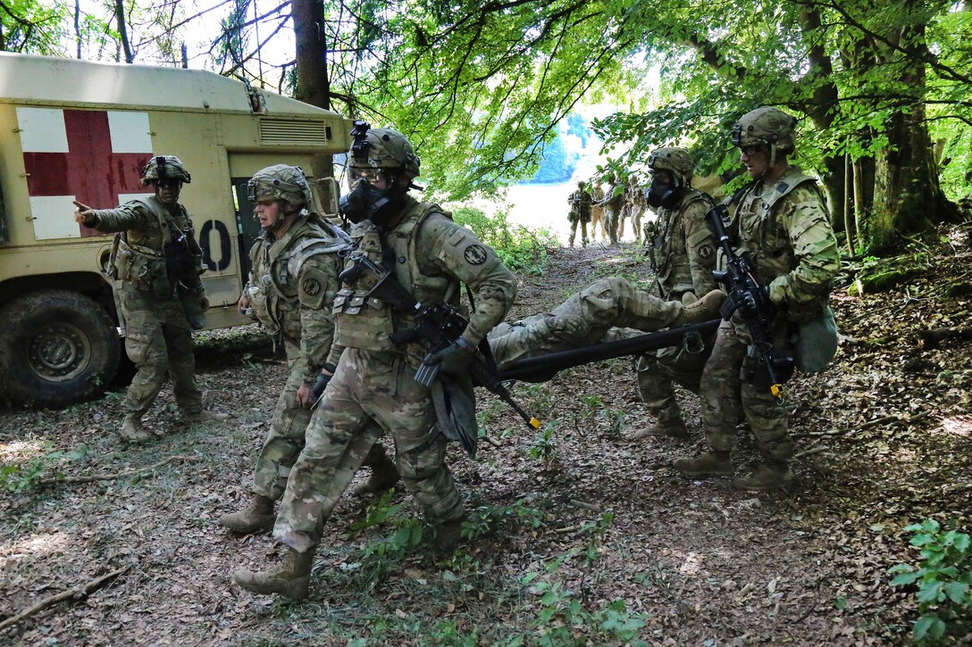 Soldiers move a mock casualty to a collection point during exercise Combined Resolve VIII at the Hohenfels Training Area, Germany, June 11, 2017. Army photo by Spc. Malik Gibson