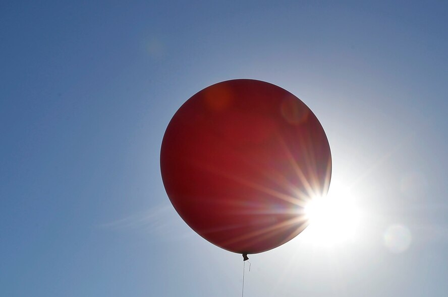 A weather balloon floats in the air at McCully Barracks, Germany, June 15, 2017. Weather troops from Germany, Poland, and Hungary joined 7th Weather Squadron Airmen for Exercise Cadre Focus. Cadre Focus is the 7th WS’s premier training program, through which the squadron aims to enhance its Airmen’s ability to work with the U.S. Army. (U.S. Air Force photo by Airman 1st Class Joshua Magbanua)