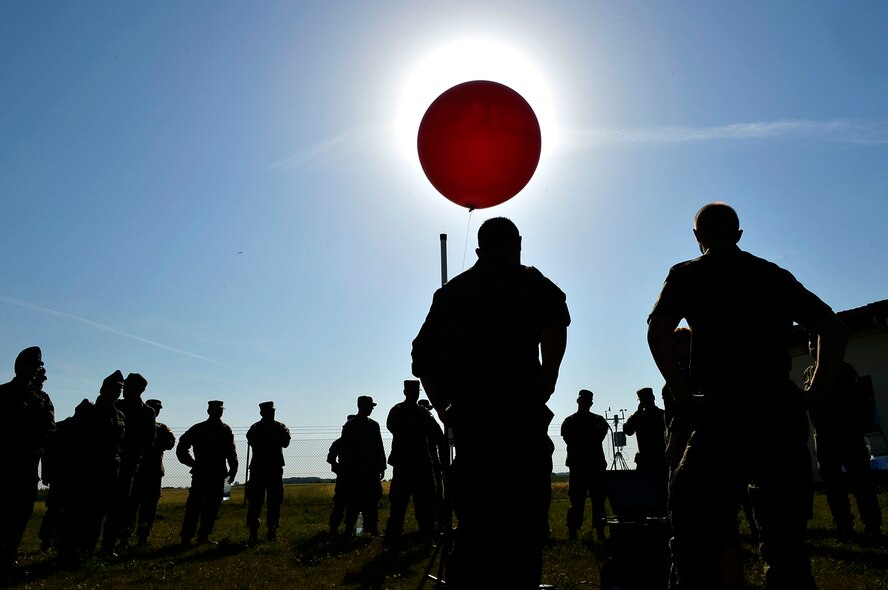 U.S. Airmen and NATO service members gather around a weather balloon at McCully Barracks, Germany, June 15, 2017. Ramstein’s 7th Weather Squadron hosted Exercise Cadre Focus 17-1, which included weather troops from Germany, Poland, and Hungary. The exercise aimed to enhance cooperation in multi-national operations. (U.S. Air Force photo by Airman 1st Class Joshua Magbanua)