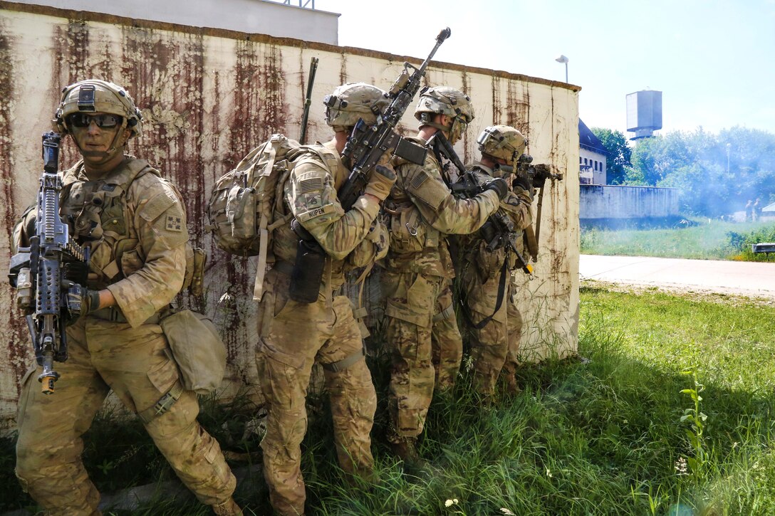 Soldiers prepare to clear buildings while conducting a town assault scenario during exercise Combined Resolve VIII at the Hohenfels Training Area, Germany, June 12, 2017. The soldiers are assigned to the 588th Brigade Engineer Battalion, 3rd Armored Brigade Combat Team. Army photo by Spc. Malik Gibson