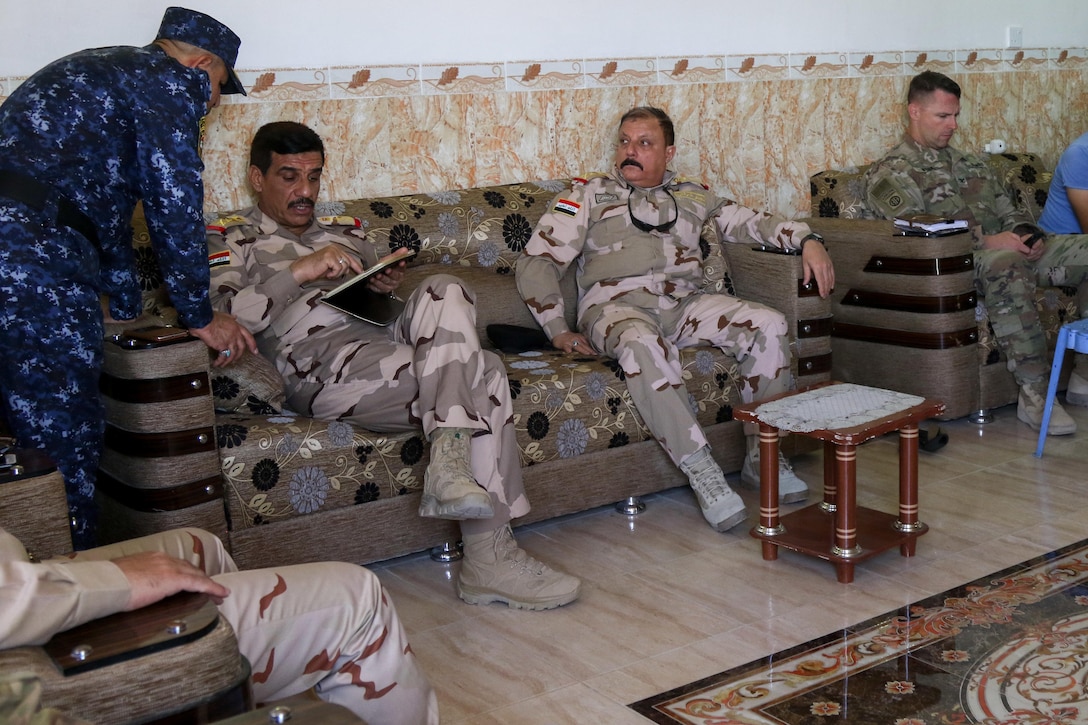 U.S. and Iraqi security force leaders discuss plans for a new tactical assembly area, near Mosul, Iraq, June 7, 2017. The Iraqi commanders met with U.S. soldiers deployed in support of Combined Joint Task Force Operation Inherent Resolve and assigned to 2nd Brigade Combat Team, 82nd Airborne Division. Army photo by Staff Sgt. Jason Hull