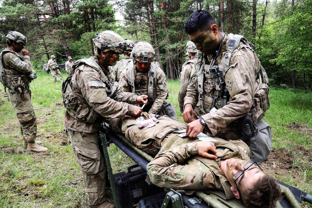 Soldiers provide tactical first aid while conducting a simulated casualty evacuation during exercise Combined Resolve VIII at the Hohenfels Training Area, Germany, June 12, 2017. Army photo by Spc. Malik Gibson