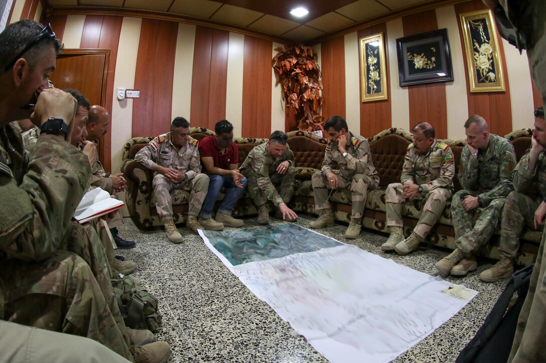 U.S. and Iraqi security force leaders discuss operations at a shared headquarters in Mosul, Iraq, June 8, 2017. The Iraqi commanders met with U.S. soldiers, deployed in support of Combined Joint Task Force Operation Inherent Resolve whose mission is to enable their partners through the advise and assist mission, contributing planning, intelligence collection and analysis, force protection and precision fires to achieve the military defeat of the Islamic State of Iraqi and Syria. Army photo by Staff Sgt. Jason Hull