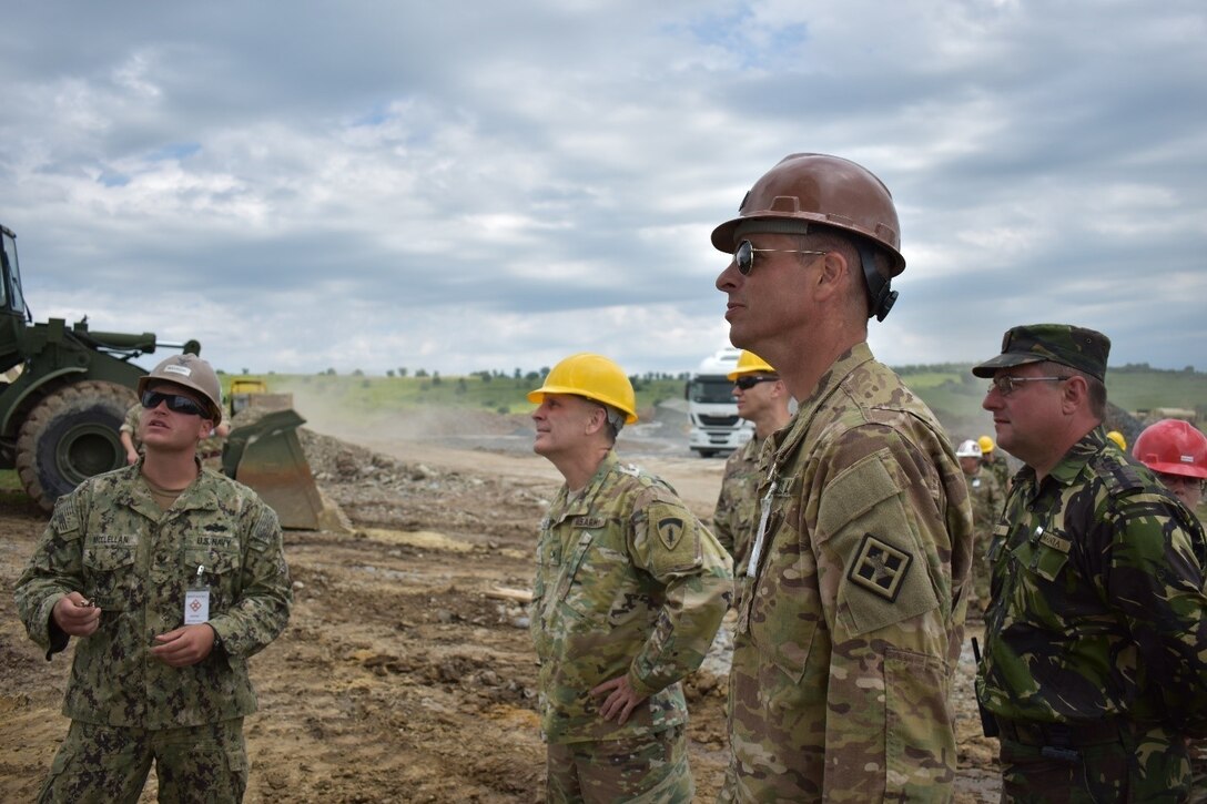 Steelworker 2nd Class Zachary McClellan of Naval Mobile Construction Battalion 1 shows Brig. Gen. Phillip S. Jolly the Seabees’ project. Now nearing completion, the Operations and Storage Building will provide support for the Non-Standard Live-Fire Range at the Joint National Training Center, Cincu, Romania. The construction is a part of Operation Resolute Castle 2017. Resolute Castle is an exercise strengthening the NATO alliance and enhancing its capacity for joint training and response to threats within the region.