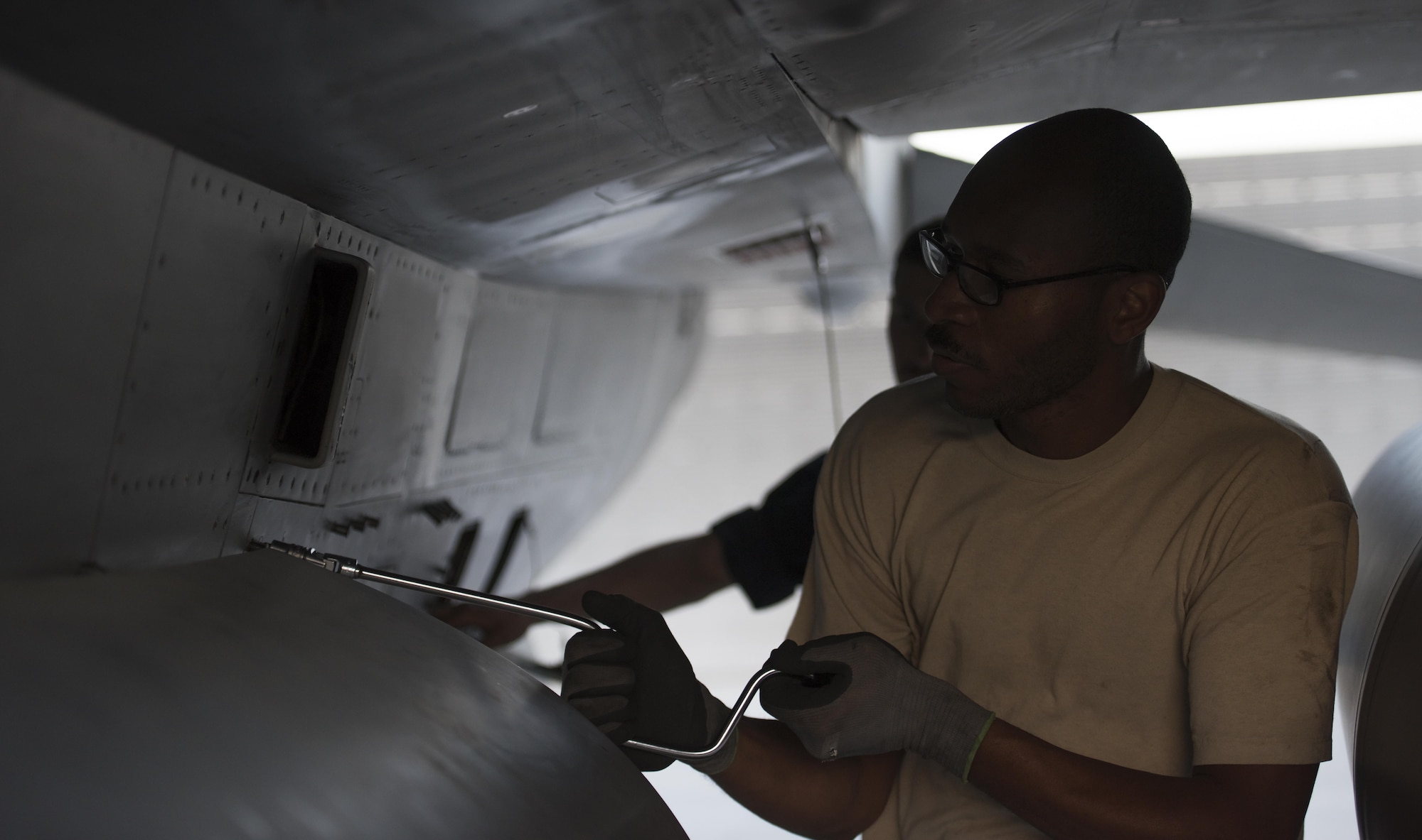 Staff Sgt. Donterrio Erby, a 455th Expeditionary Aircraft Maintenance Squadron aerospace propulsion technician, secures a panel onto an F-16 Fighting Falcon at Bagram Airfield, Afghanistan, June 16, 2017. Aerospace propulsion technicians diagnose engine problems, which includes the fuel, oil, electrical and engine airflow systems, and recommends a course of action on how to fix them. Erby is a native of Columbus, Mississippi. (U.S. Air Force photo by Staff Sgt. Benjamin Gonsier) 