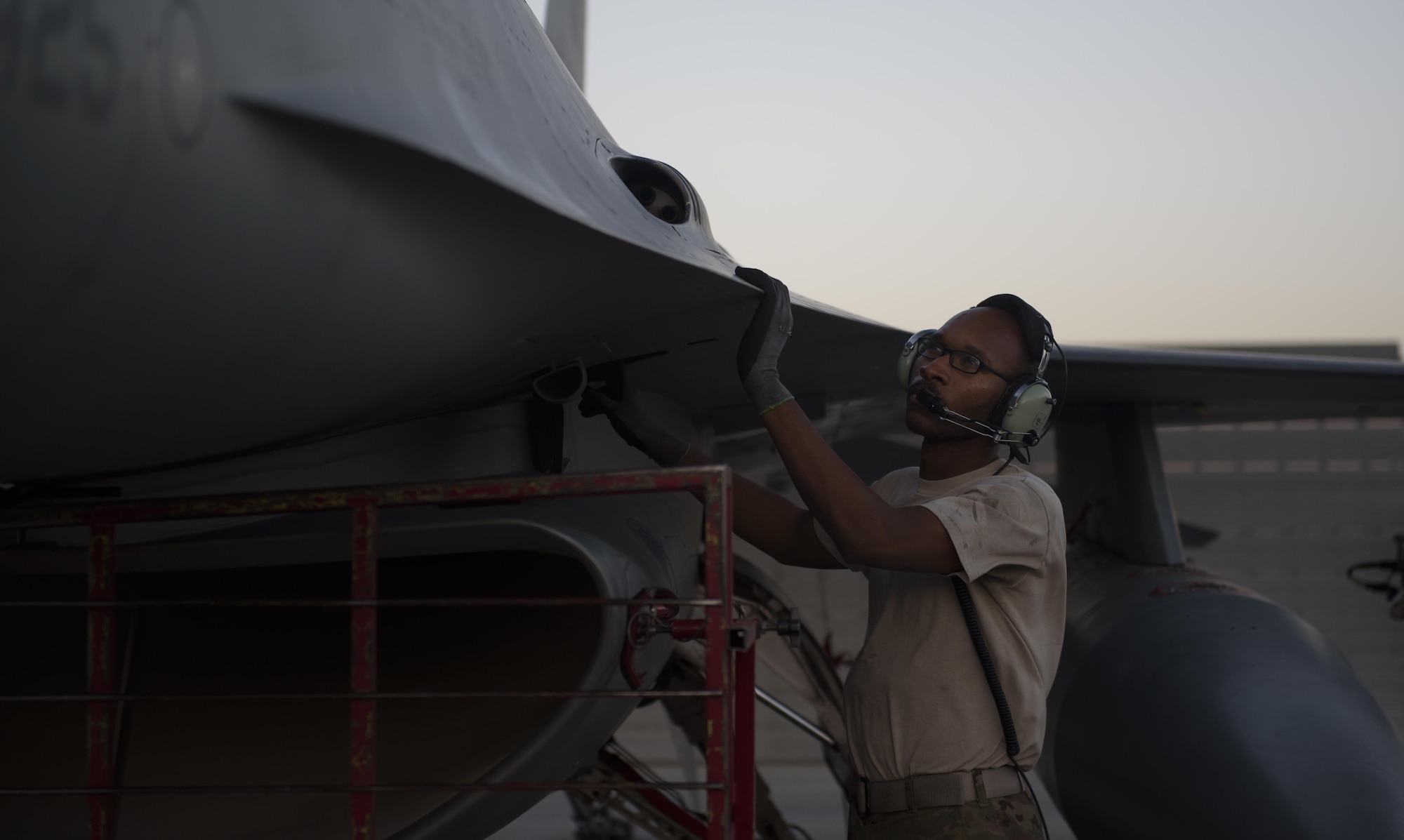 Staff Sgt. Donterrio Erby, a 455th Expeditionary Aircraft Maintenance Squadron aerospace propulsion technician, performs an inspection of an F-16 Fighting Falcon before conducting an afterburner run at Bagram Airfield, Afghanistan, June 16, 2017. Conducting afterburner runs enables maintainers to discover possible problems with the engine that may not be detectable through regular inspections. (U.S. Air Force photo by Staff Sgt. Benjamin Gonsier) 