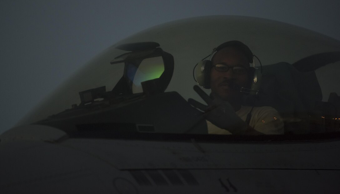 Staff Sgt. Donterrio Erby, a 455th Expeditionary Aircraft Maintenance Squadron aerospace propulsion technician, shows his unit pride by displaying the “Triple Nickel” sign at Bagram Airfield, Afghanistan, June 16, 2017. Erby is deployed out of Aviano Air Base, Italy, where he performs engine maintenance on F-16 Fighting Falcons assigned to the 555th Expeditionary Fighter Squadron. (U.S. Air Force photo by Staff Sgt. Benjamin Gonsier)