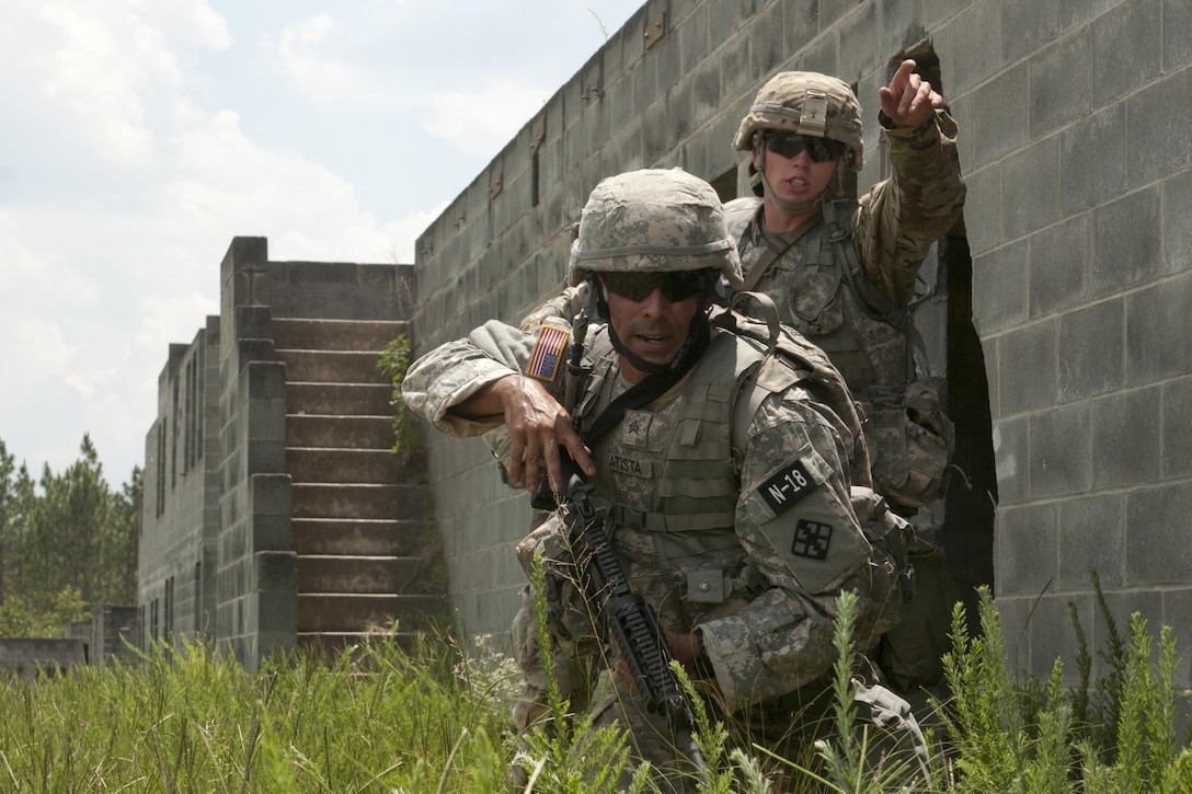 Sgt. Luciano Batista (left) and Sgt. Michael Hughes react to a simulated attack during combat-skills lanes at the 2017 U.S. Army Reserve Best Warrior Competition at Fort Bragg, N.C. June 14. This year’s Best Warrior Competition will determine the top noncommissioned officer and junior enlisted Soldier who will represent the U.S. Army Reserve in the Department of the Army Best Warrior Competition later this year at Fort A.P. Hill, Va. (U.S. Army Reserve photo by Sgt. David Turner) (Released)