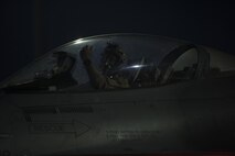 A 555th Expeditionary Fighter Squadron pilot waits for directions at Bagram Airfield, Afghanistan, June 16, 2017. The 555th EFS deployed to Bagram Airfield as part of a rotation of fighters, which have had a constant presence in Afghanistan for more than a decade. The F-16s presence here serves the counterterrorism mission and deters actions against coalition forces—day or night. (U.S. Air Force photo by Staff Sgt. Benjamin Gonsier) 