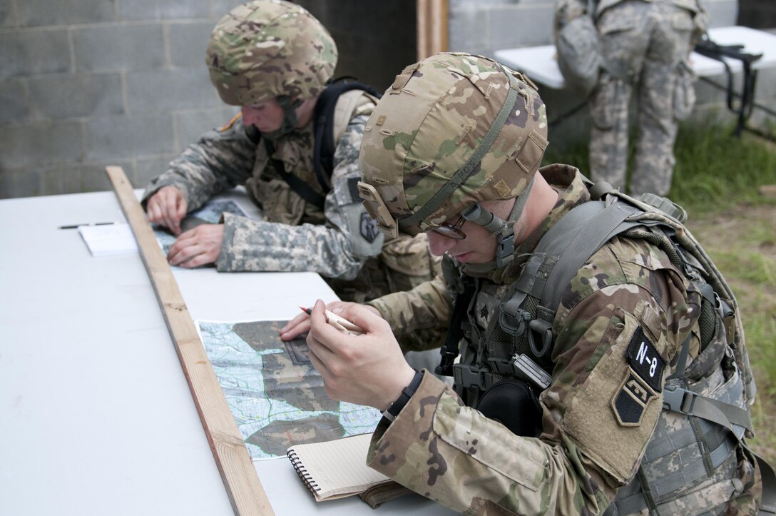 Warriors plot coordinates during the combat skills testing event at the 2017 U.S. Army Reserve Best Warrior Competition at Fort Bragg, N.C. June 14, 2017. This year’s Best Warrior Competition will determine the top noncommissioned officer and junior enlisted Soldier who will represent the U.S. Army Reserve in the Department of the Army Best Warrior Competition later this year at Fort A.P. Hill, Va. (U.S. Army Reserve photo by Sgt. Jennifer Shick) (Released)