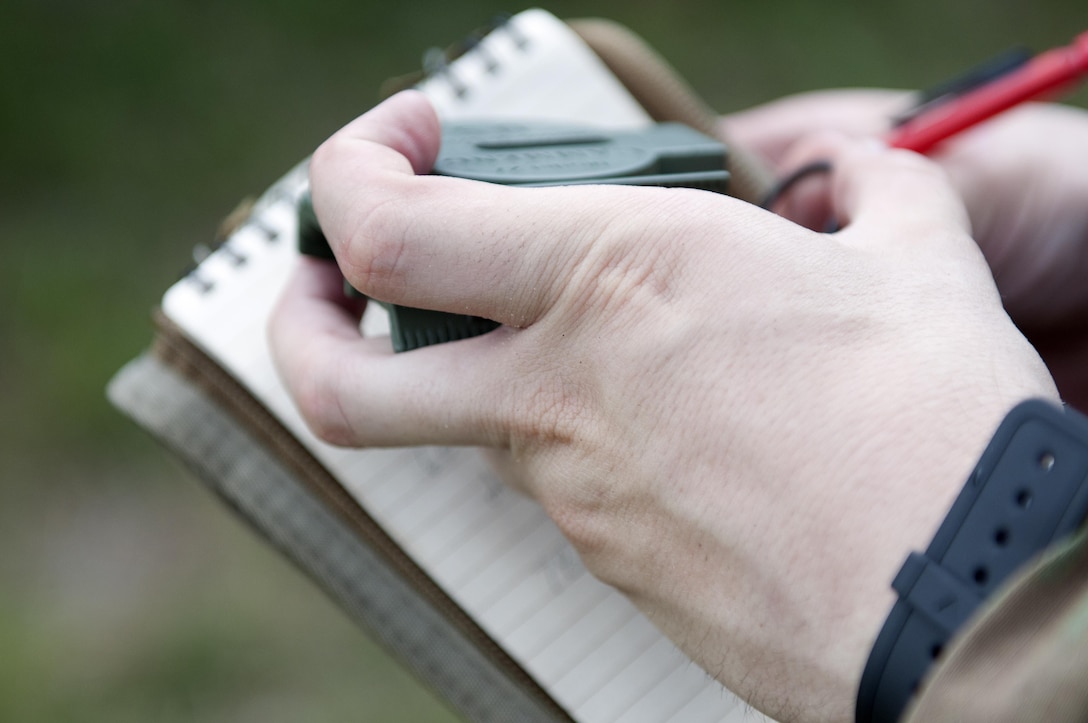 A Warrior uses a compass to plot coordinates during the combat skills testing event at the 2017 U.S. Army Reserve Best Warrior Competition at Fort Bragg, N.C. June 14. This year’s Best Warrior Competition will determine the top noncommissioned officer and junior enlisted Soldier who will represent the U.S. Army Reserve in the Department of the Army Best Warrior Competition later this year at Fort A.P. Hill, Va. (U.S. Army Reserve photo by Sgt. Jennifer Shick) (Released)