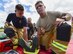 U.S. Air Force firefighters, as well as medical personnel and Royal Air Force Fairford Firefighters, work together to lift a gurney during a medical exercise at RAF Fairford, U.K., June 13, 2017. Exercises like this increase interoperability between the two departments and prepare them to work together during real-life scenarios. (U.S. Air Force photo by Airman 1st Class Randahl J. Jenson)