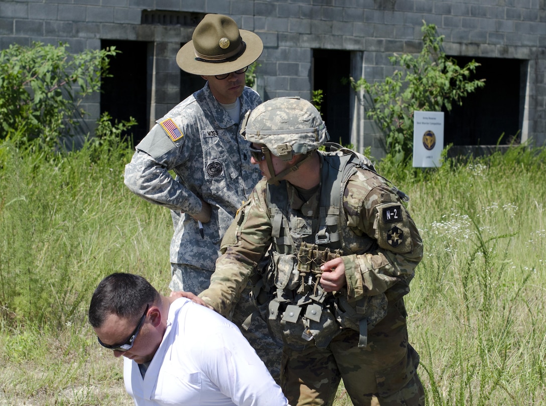 Cpl. Carlo Deldonno a Healthcare Specialist representing the 3rd Medical Command (Deployment Support), searches a civilian for contraband during the Combat Skills Testing Lanes at the 2017 U.S. Army Reserve Best Warrior Competition at Fort Bragg, N.C. June 14. This year’s Best Warrior Competition will determine the top noncommissioned officer and junior enlisted Soldier who will represent the U.S. Army Reserve in the Department of the Army Best Warrior Competition later this year at Fort A.P. Hill, Va. (U.S. Army Reserve photo by Sgt. William A. Parsons) (Released)