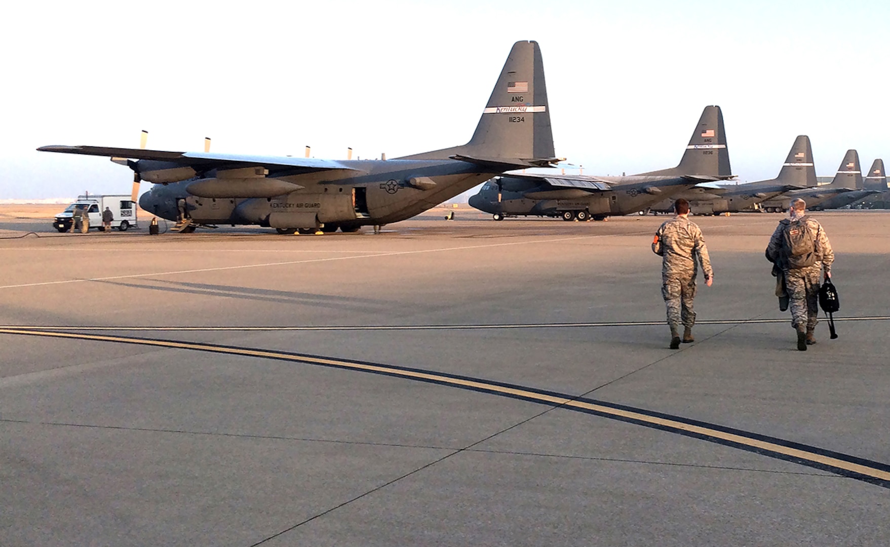 Airmen from the 123rd Contingency Response Group head toward aircraft at the Louisville International Airport, Louisville, Kentucky.