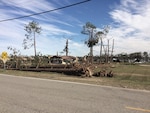 An EF3 tornado ravaged areas of Albany, Georgia, uprooting trees and destroying buildings along its 70-mile path. DLA Information Operations provided assistance to DLA Distribution employees in getting back up and operating.