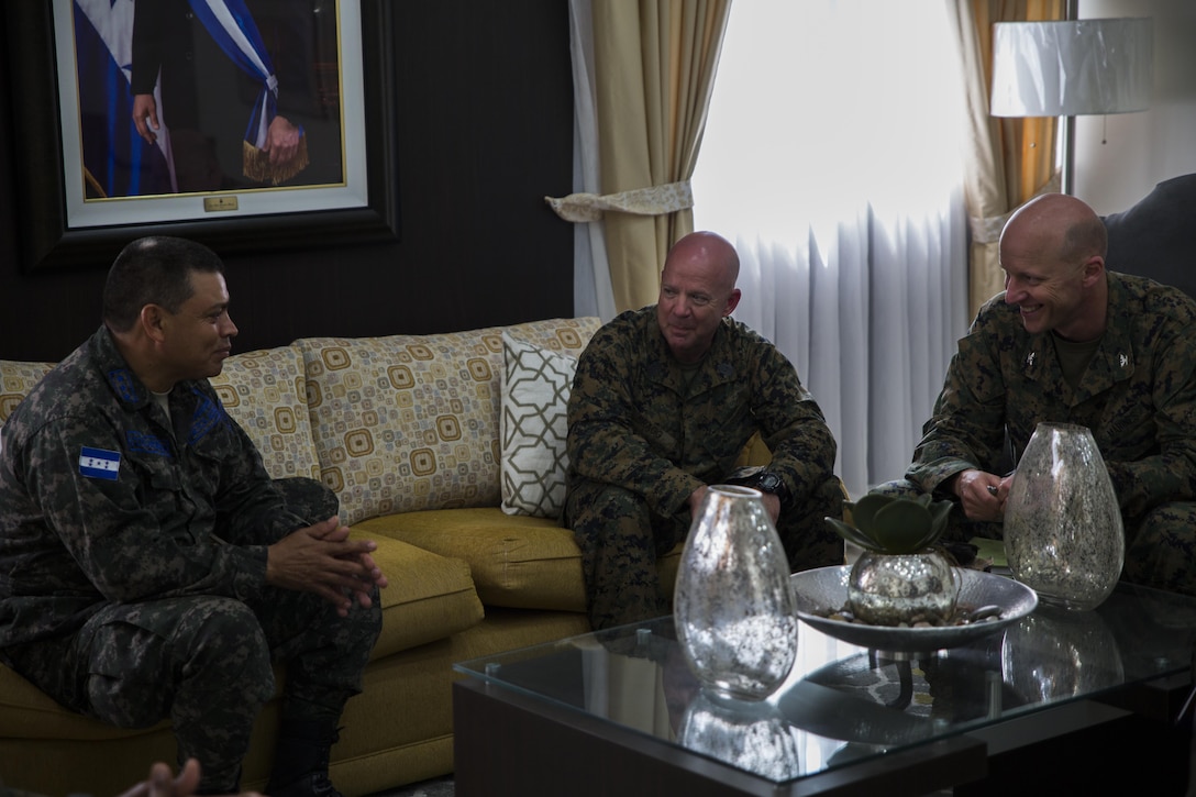 Honduran Air Force Col. Jose S. Colindres, left, Soto Cano Air Base commander, U.S. Marine Sgt. Maj. Glenn D. Bragg, center, sergeant major of Special Purpose Marine Air-Ground Task Force - Southern Command, and U.S. Marine Col. Michael V. Samarov, commander of SPMAGTF-SC, speak together during a meeting at Soto Cano Air Base, Honduras, June 7, 2017. The purpose of the meeting was to establish a line of communication between SPMAGTF-SC and the Honduran service members on the base in order to develop a positive working relationship. (U.S. Marine Corps photo by Cpl. Melissa Martens)