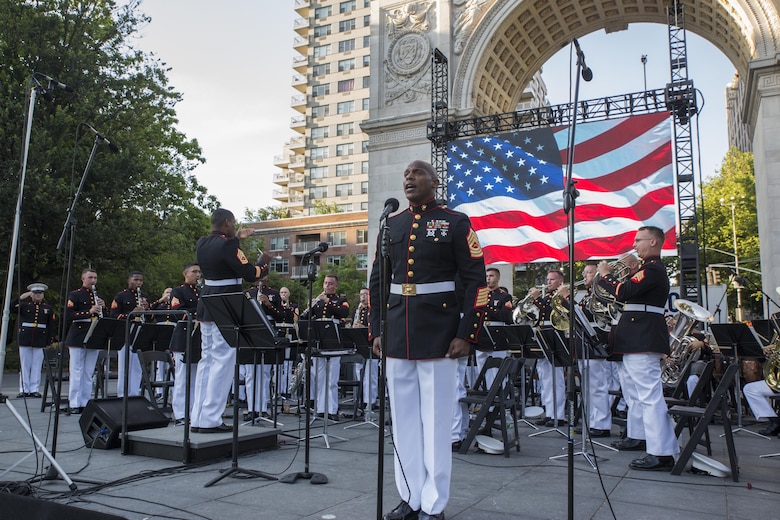 Master Sgt. Billy Richardson, the Marine Forces Reserve equal opportunity advisor, sings “The Star-Spangled Banner” while performing with the Marine Corps Band New Orleans at Washington Square Park in New York, June 14, 2017. The band traveled to New York to celebrate the ending of the Marine Corps Reserve Centennial, marking the end of the hundredth year anniversary of the establishment of the Marine Corps Reserve. (U.S. Marine Corps photo by Lance Cpl. Niles Lee/Released)
