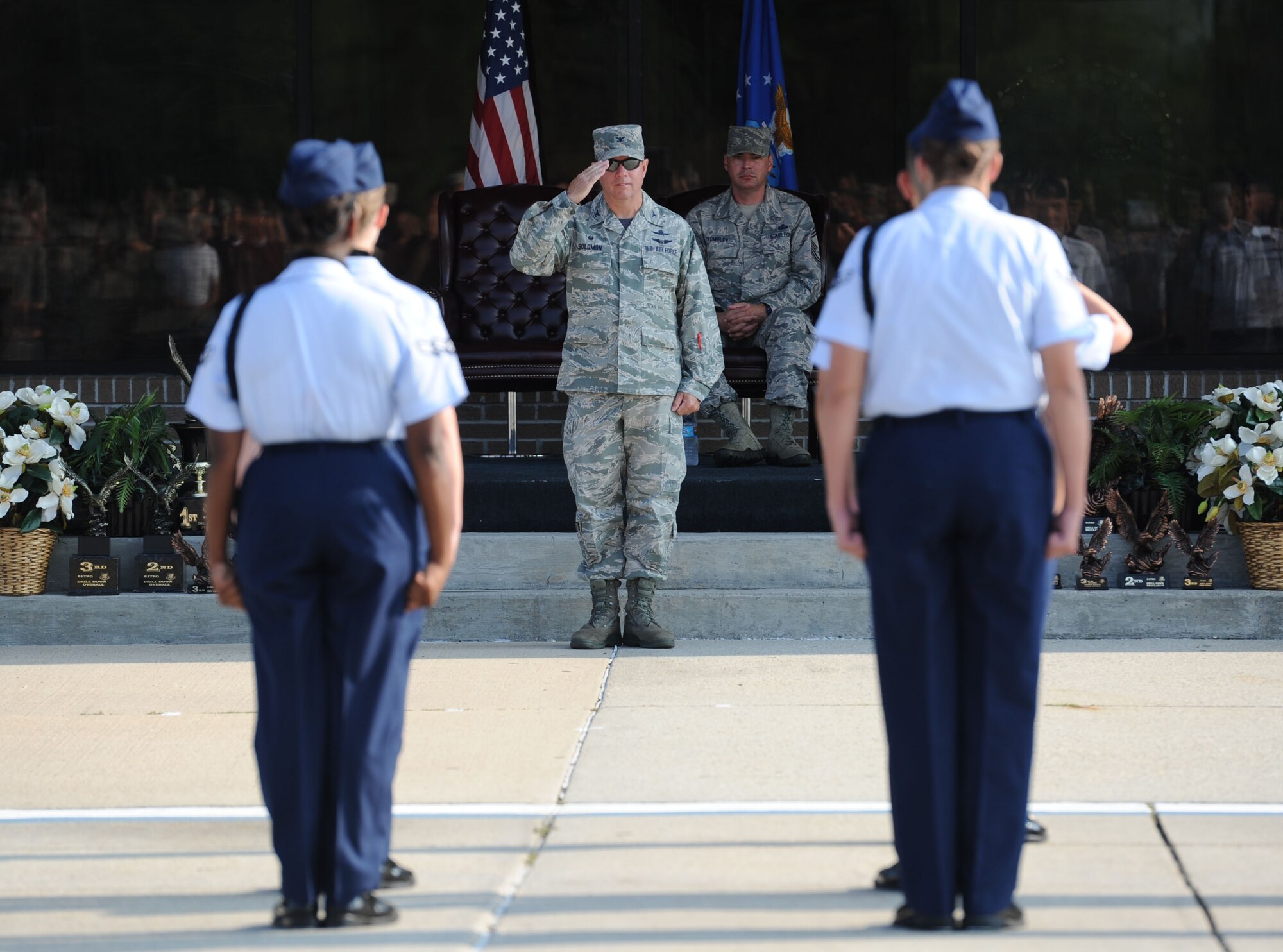 Col. Scott Solomon, 81st Training Group commander, salutes the 335th Training Squadron regulation drill team before their performance during the 81st TRG drill down on the Levitow Training Support Facility drill pad June 16, 2017, on Keesler Air Force Base, Miss. Airmen from the 81st TRG competed in a quarterly open ranks inspection, regulation drill routine and freestyle drill routine. The 334th TRS “Gators” took first place this quarter. (U.S. Air Force photo by Kemberly Groue)