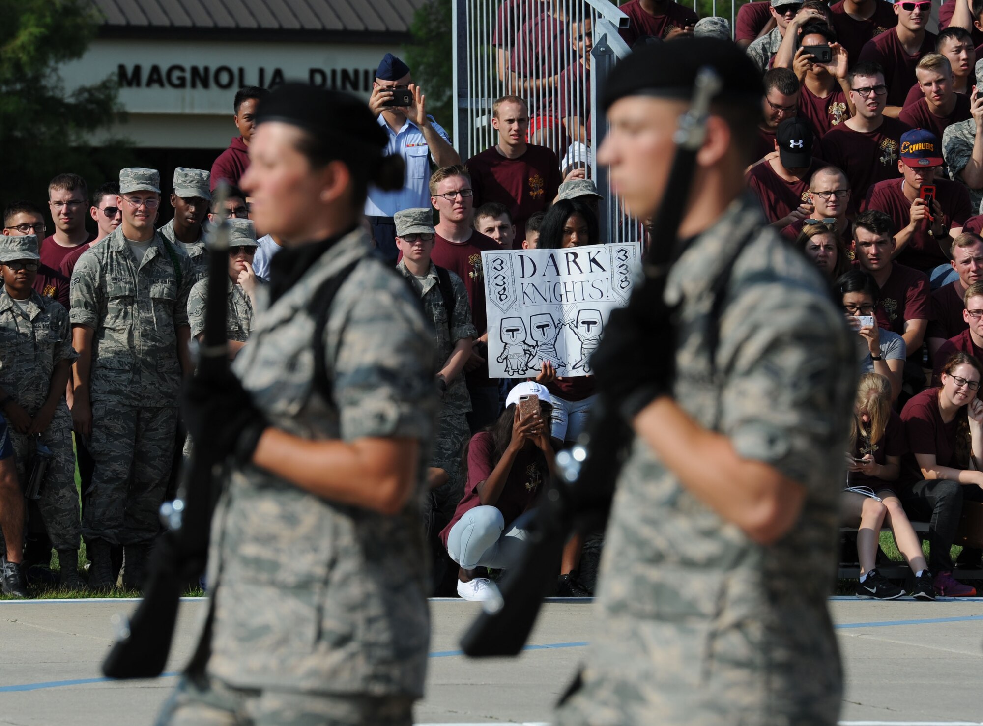 Airmen from the 338th Training Squadron display a poster supporting their squadron freestyle drill team as they perform during the 81st Training Group drill down on the Levitow Training Support Facility drill pad June 16, 2017, on Keesler Air Force Base, Miss. Airmen from the 81st TRG competed in a quarterly open ranks inspection, regulation drill routine and freestyle drill routine. The 334th TRS “Gators” took first place this quarter. (U.S. Air Force photo by Kemberly Groue)