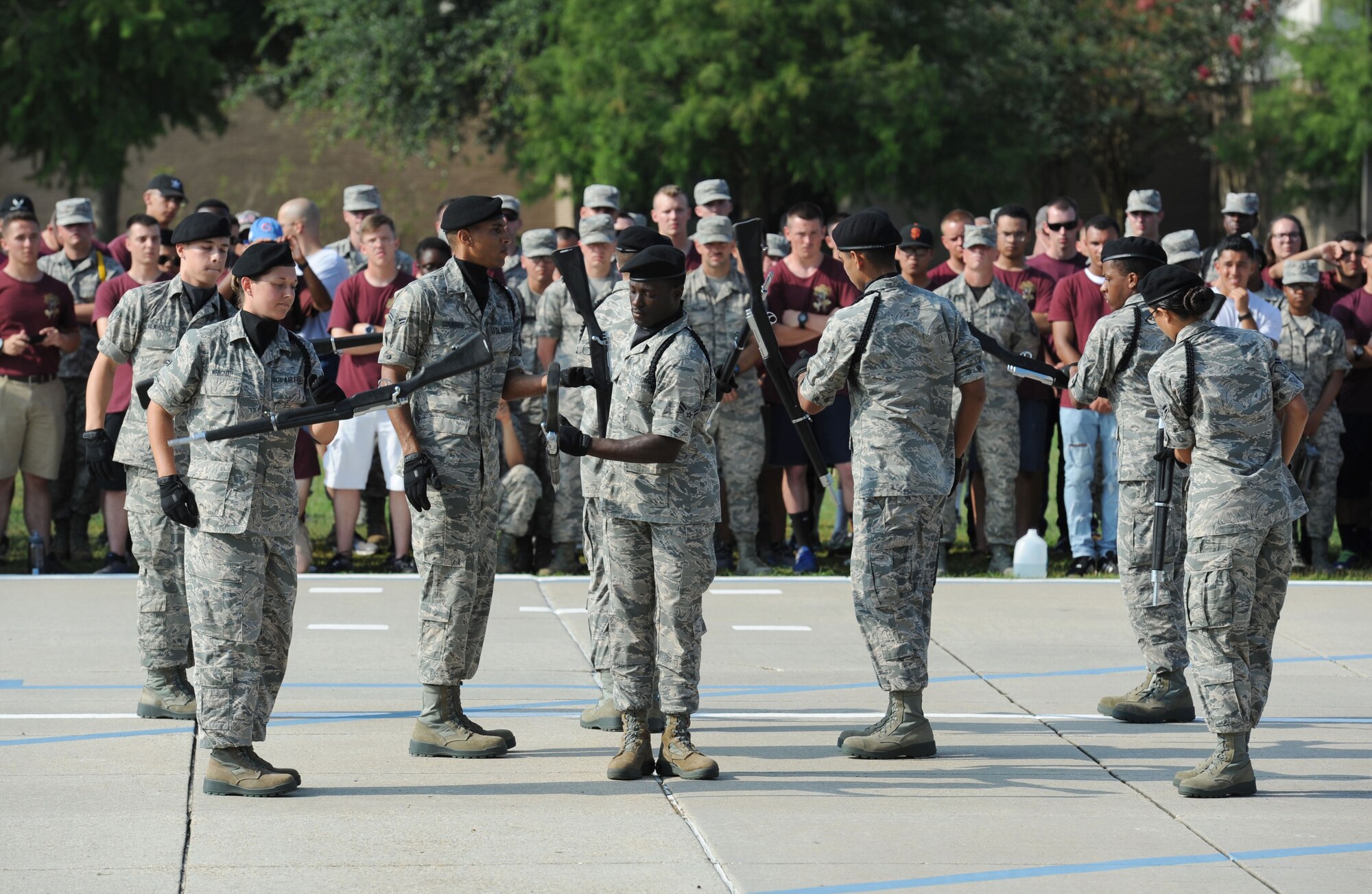 Members of the 338th Training Squadron freestyle drill team perform during the 81st Training Group drill down on the Levitow Training Support Facility drill pad June 16, 2017, on Keesler Air Force Base, Miss. Airmen from the 81st TRG competed in a quarterly open ranks inspection, regulation drill routine and freestyle drill routine. The 334th TRS “Gators” took first place this quarter. (U.S. Air Force photo by Kemberly Groue)
