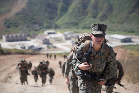 U.S. Marine Staff Sgt. Iris Marini, a supply admin training chief for Combat Logistics Battalion 5, Combat Logistics Regiment 1, 1st Marine Logistics Group participates in a six mile conditioning hike on Camp Pendleton, Calif., June 16, 2017. The Marines have four conditioning hikes to prepare for Mountain Exercise 4-17 which will be conducted on the Marine Corps Mountain Warfare Training Center in Bridgeport, Calif. (U.S. Marine Corps photo by Lance Cpl. Timothy Shoemaker)