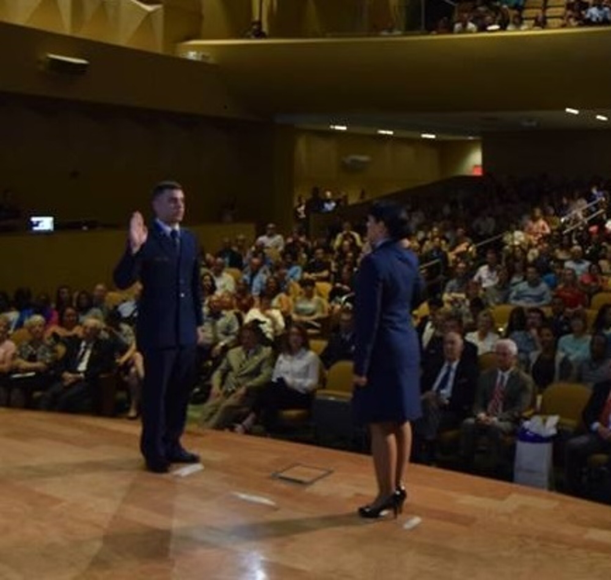 During a ceremony in Tampa, Fla., Maj. Roxana Hambleton, from Homestead Air Reserve Base, Fla., was granted a four-day pass to commission her son Ben as a second lieutenant into the United States Air Force. She is currently deployed to an undisclosed location in Southwest Asia. (Courtesy photo) 