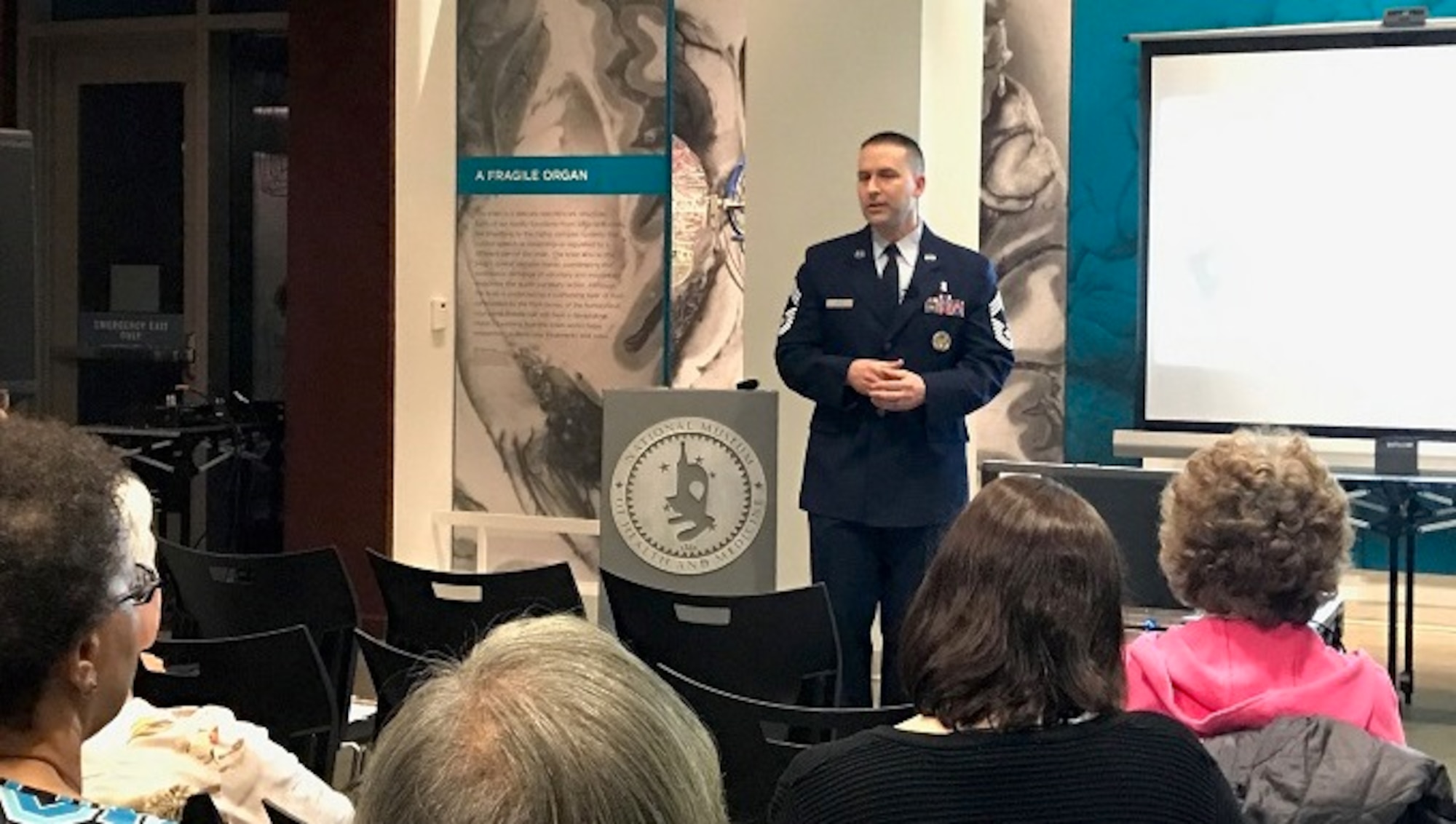 Chief Master Sergeant David J. Little, Chief, Medical Operations and Research, Office of the Air Force Surgeon General, speaks during the Feb. 2017 Medical Museum Science Café at the National Museum of Health and Medicine, on Tues., Feb. 28, 2017. Little's program was titled "Air Force Medical Service: Building Competent, Capable Enlisted Airmen."