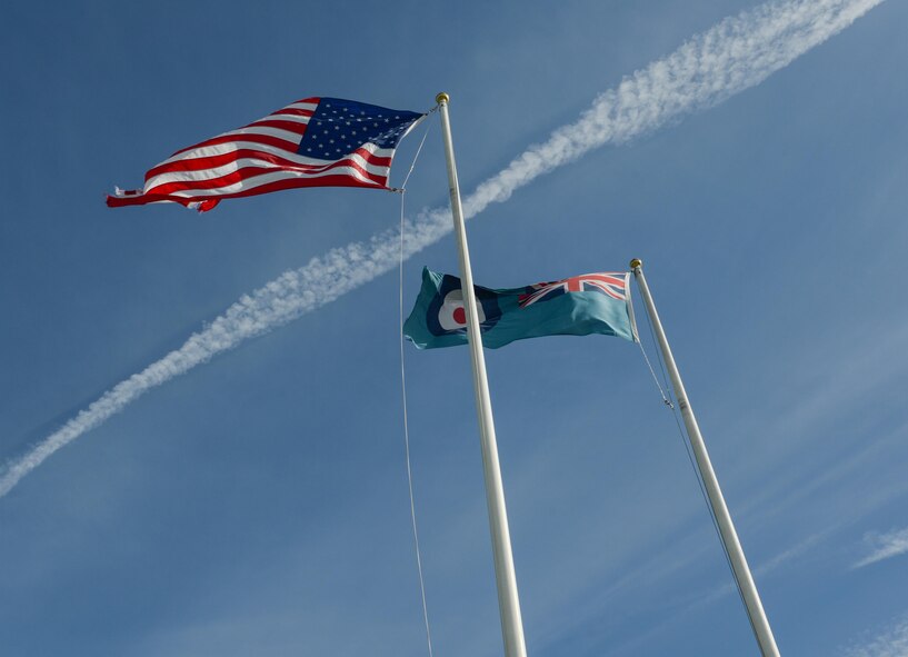 The United States American flag and the Royal Air Force flag fly together above Royal Air Force Fairford, United Kingdom, June 9, 2017, representing the shared and enduring commitment to the NATO alliance and in defense of freedom. Operations and engagements with allies and partners, such as bomber assurance and deterrence missions out of RAF Fairford, demonstrate and strengthen the shared commitment to global security and stability. U.S. Strategic Command routinely conducts bomber operations across the globe as a demonstration of U.S. commitment to collective defense and to integrate with Geographic Combatant Command operations and activities. (U.S. Air Force photo/Senior Airman Curt Beach)
