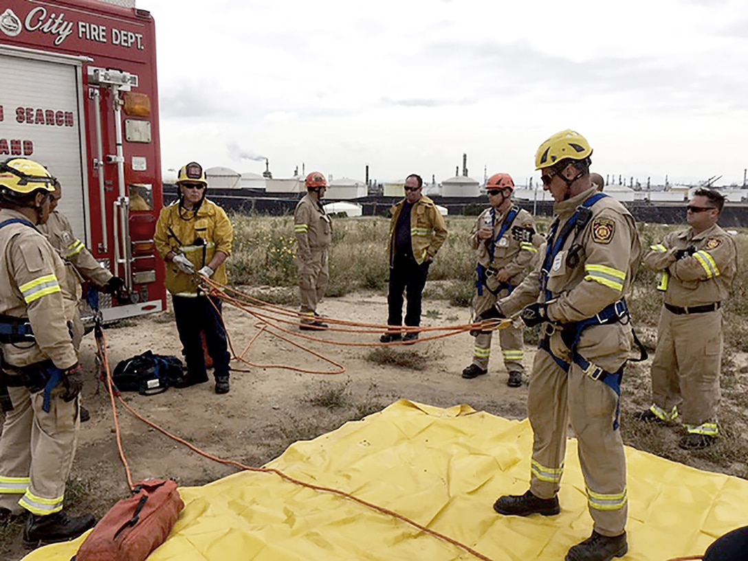 Los Angeles firefighters prepare to train in rescuing victims from combined spaces at Defense Fuel Support Point San Pedro.