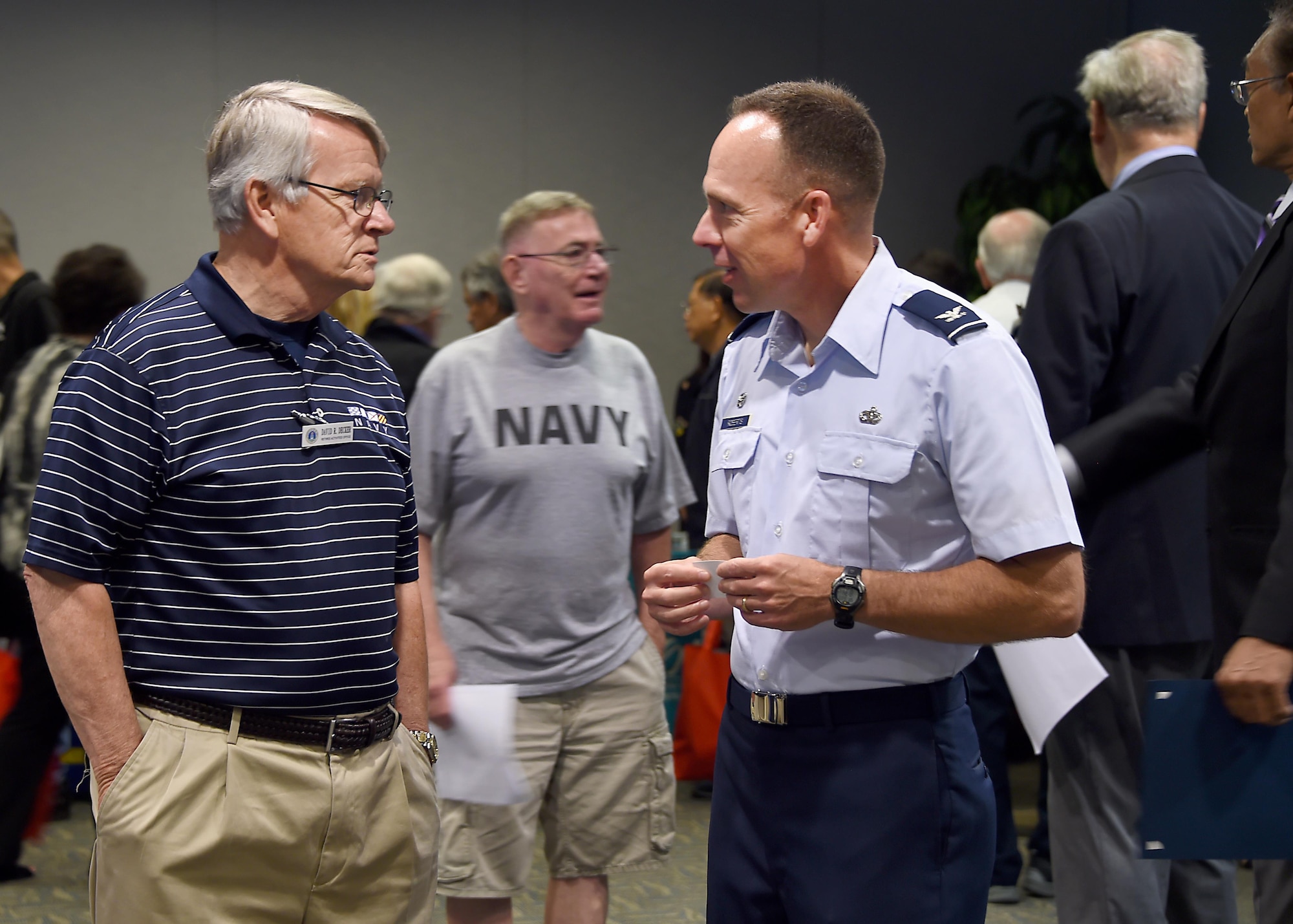 Col. Charles Roberts, commander of the 61st Air Base Group, chats with David Decker, a Navy veteran and volunteer with the Retiree Activities Office at Los Angeles Air Force Base during the annual Armed Forces Retiree Appreciation Day, held June 3, 2017. (U.S. Air Force photo/Joseph Juarez, Sr.)  