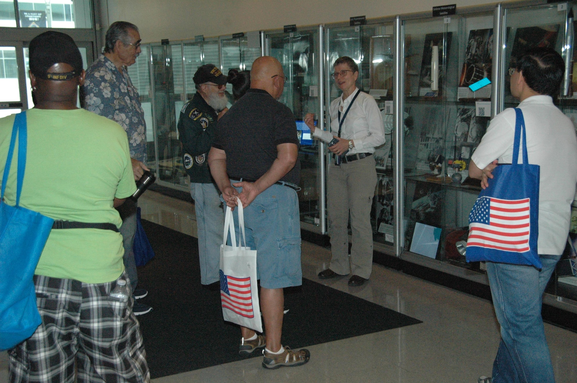 Karen Austin (center), Space and Missile Systems Center Historian, takes on the herculean task of leading three back-to-back tours of the SMC Missile Heritage Center for retirees and their guests during the annual Armed Forces Retiree Appreciation Day, June 3, 2017, at Los Angeles Air Force Base in El Segundo, California. (U.S. Air Force photo/ James Spellman, Jr.)  


