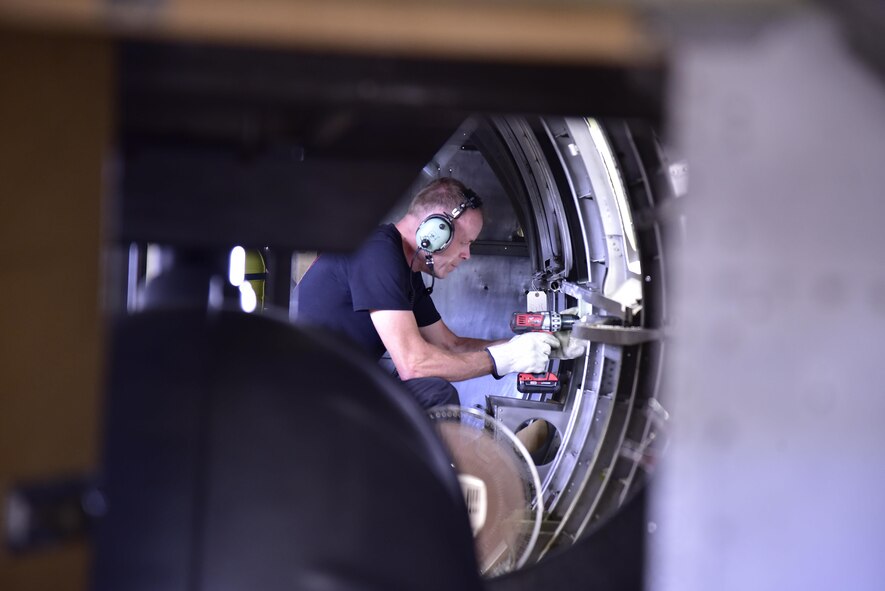 DAYTON, Ohio (06/2017) -- Restoration Specialist Brian Lindamood works on the fuselage of the B-17F "Memphis Belle"™ in the restoration hangar at the National Museum of the U.S. Air Force. The exhibit opening for this aircraft is planned for May 17, 2018.(U.S. Air Force photo by Ken LaRock) 