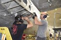 DAYTON, Ohio (06/2017) -- (From left to right) Restoration Specialists Jason Davis and Chase Meredith work on the B-17F &quot;Memphis Belle&quot;™ in the restoration hangar at the National Museum of the U.S. Air Force. The exhibit opening for this aircraft is planned for May 17, 2018.(U.S. Air Force photo by Ken LaRock) 