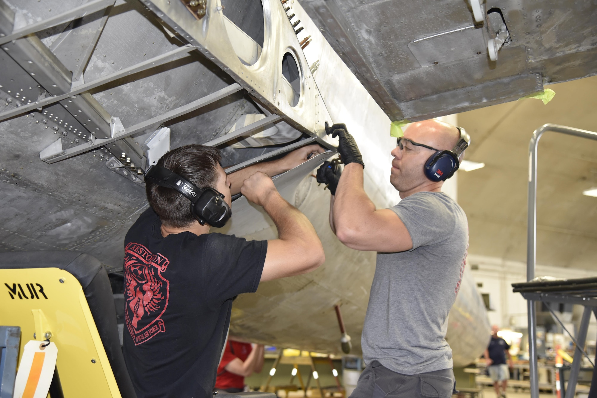 DAYTON, Ohio (06/2017) -- (From left to right) Restoration Specialists Jason Davis and Chase Meredith work on the B-17F "Memphis Belle"™ in the restoration hangar at the National Museum of the U.S. Air Force. The exhibit opening for this aircraft is planned for May 17, 2018.(U.S. Air Force photo by Ken LaRock)