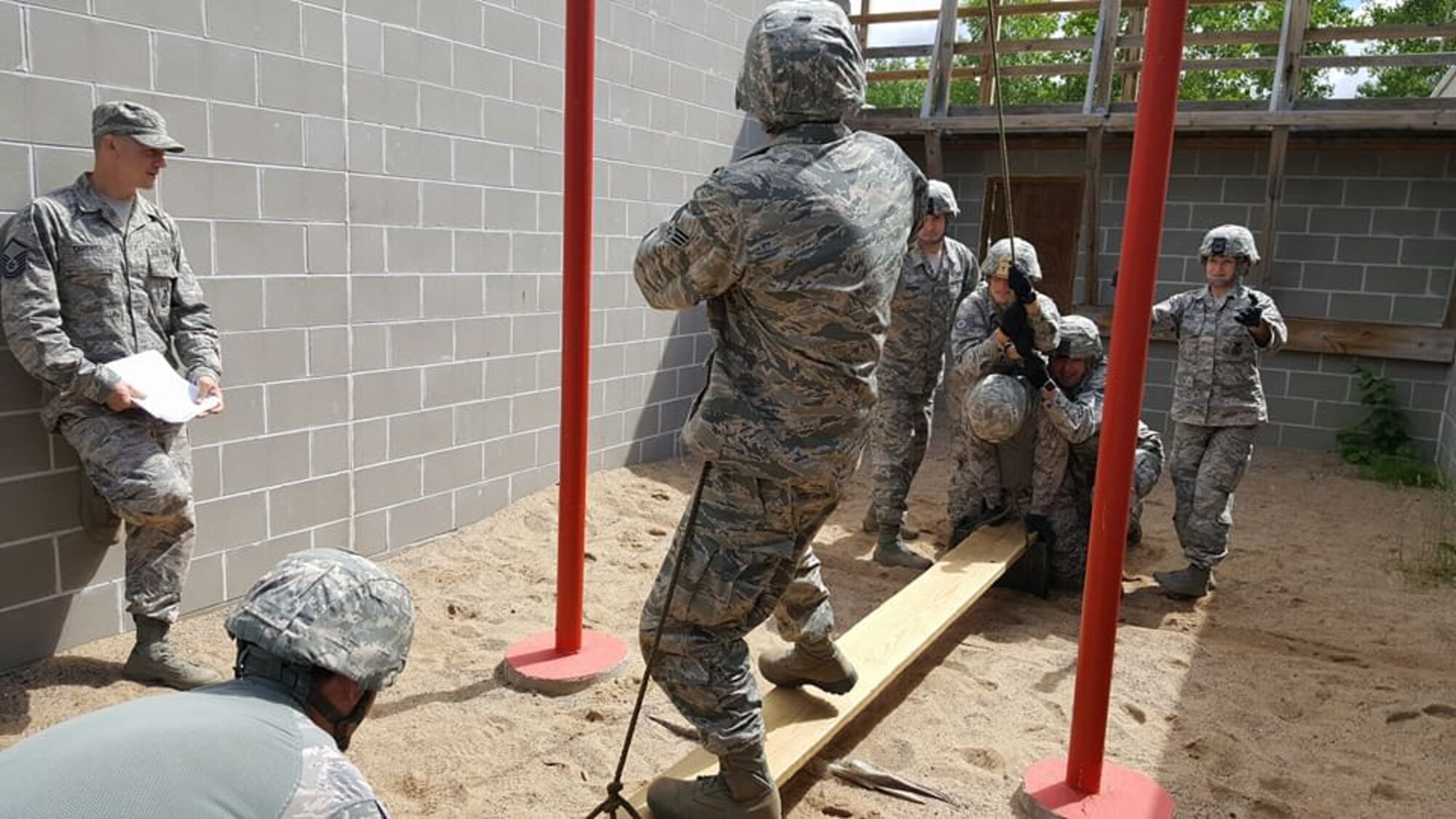 Members of the 934th Security Forces Squadron negotiate the Leadership Reaction Course at Camp Ripley, Minn. June 19 as part of their annual training. (Photo courtesy of Camp Ripley)