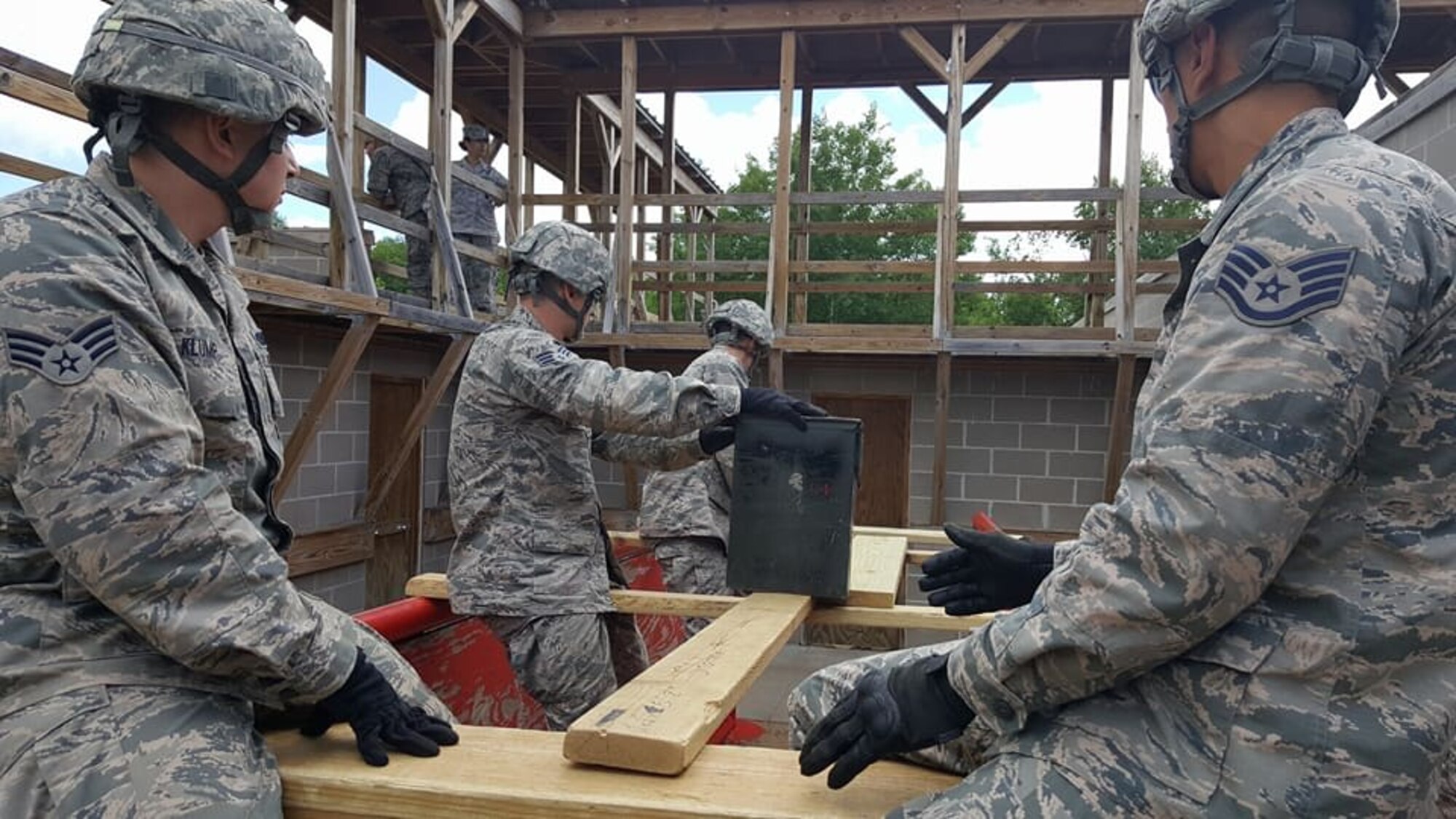 Members of the 934th Security Forces Squadron negotiate the Leadership Reaction Course at Camp Ripley, Minn. June 19 as part of their annual training. (Photo courtesy of Camp Ripley)
