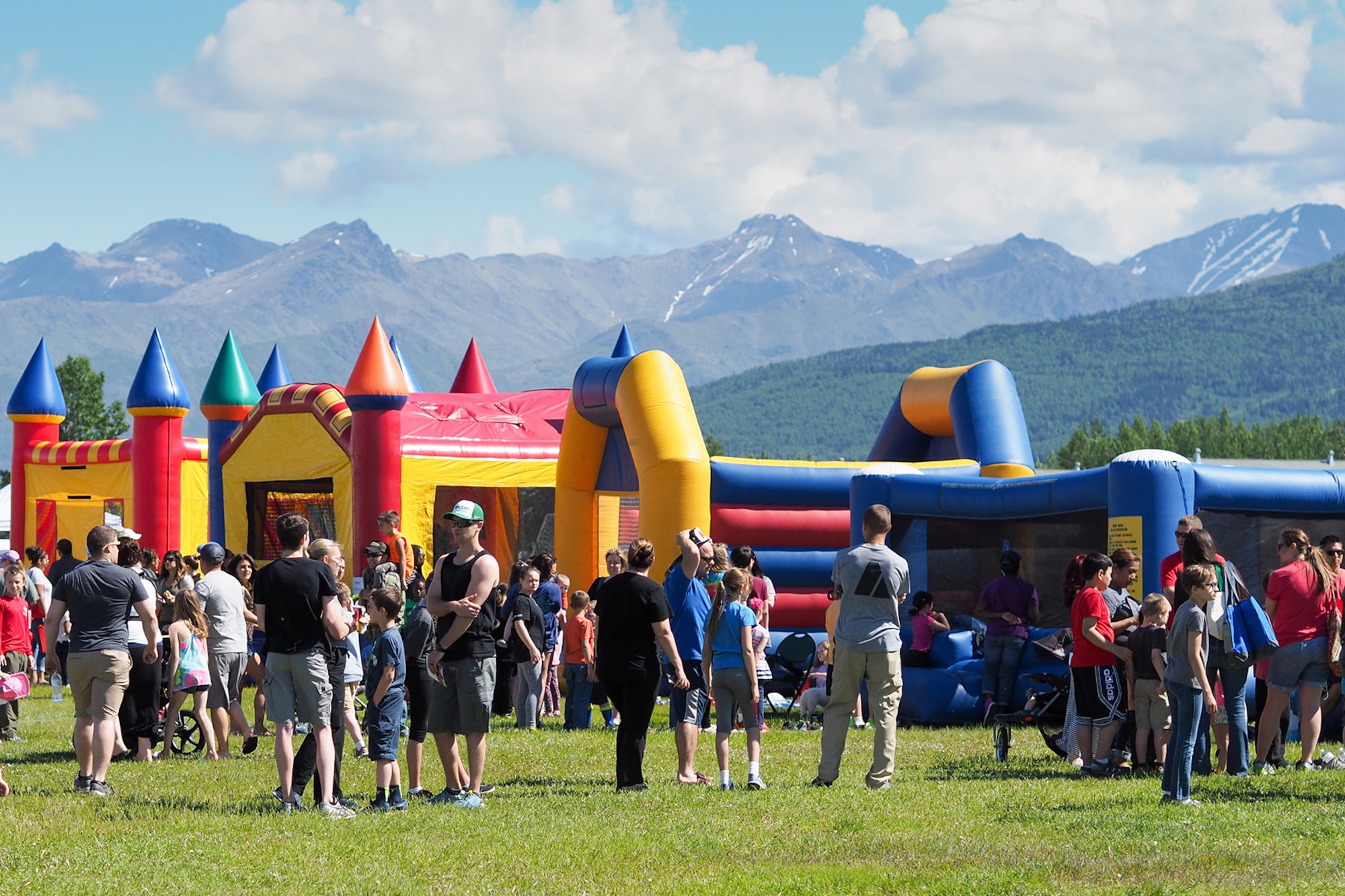 Service members, dependents, and Department of Defense civilians attend the Military Appreciation Week picnic at the Joint Base Elmendorf-Richardson, Alaska, Buckner Fitness Center fields June 16, 2017. Several organizations came together to provide a variety of family-fun activities such as competitive sporting events for the adults, face painting and bouncy houses for the children in addition to the Anchorage Chamber of Commerce-provided food and music during the annual event.