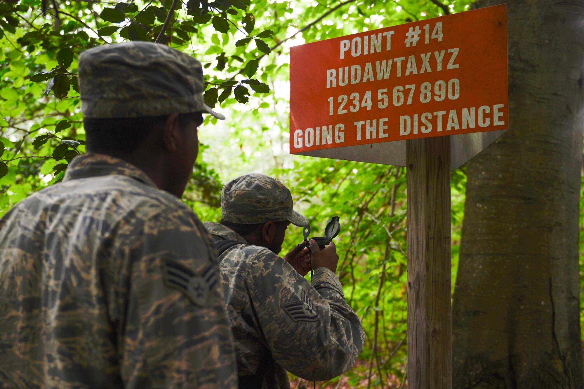 U.S. Air Force Staff Sgt. Duron Washington, right, and Senior Airman Ki’Andrei White, both 633rd Civil Engineer Squadron pavement and construction equipment craftsmen, participate during a Prime Base Engineer Emergency Force land navigation training at Joint Base Langley-Eustis, Va., June 15, 2017. The training enabled the CES Airmen to boost their confidence when navigating through unknown territories without technological devices. (U.S. Air Force photo/Airman 1st Class Kaylee Dubois)