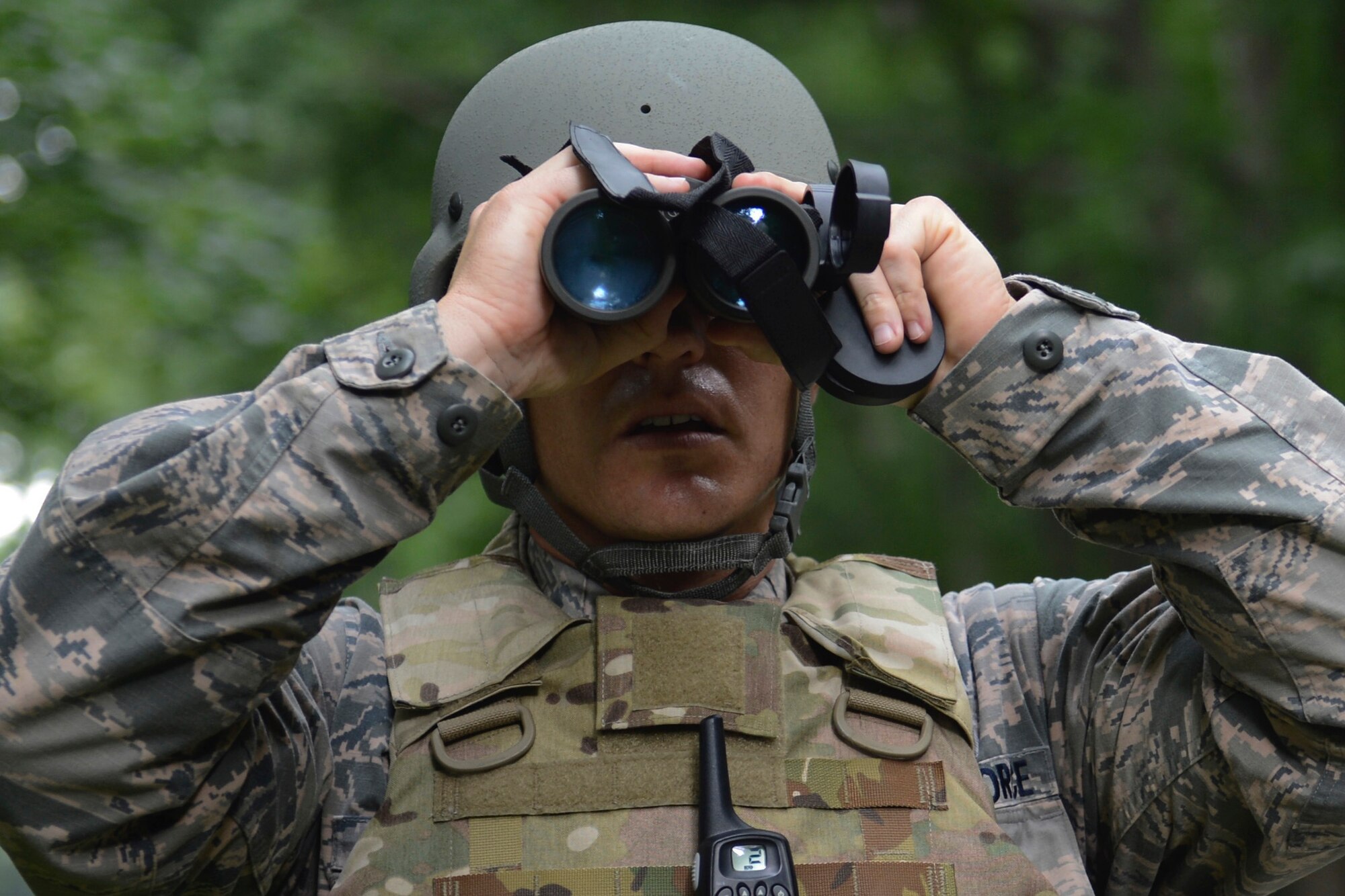 U.S. Air Force Tech. Sgt. Matthew Lawrence, 633rd Civil Engineer Squadron NCO in charge of explosive ordnance device training, scans for a simulated improvised explosive device during a Prime Base Engineer Emergency Force convoy training at Joint Base Langley-Eustis, Va., June 15, 2017. As part of a joint base, the 633rd CES team saves time and money using the facilities at Fort Eustis, Va., to provide a deployed-like environment for training. (U.S. Air Force photo/Airman 1st Class Kaylee Dubois)