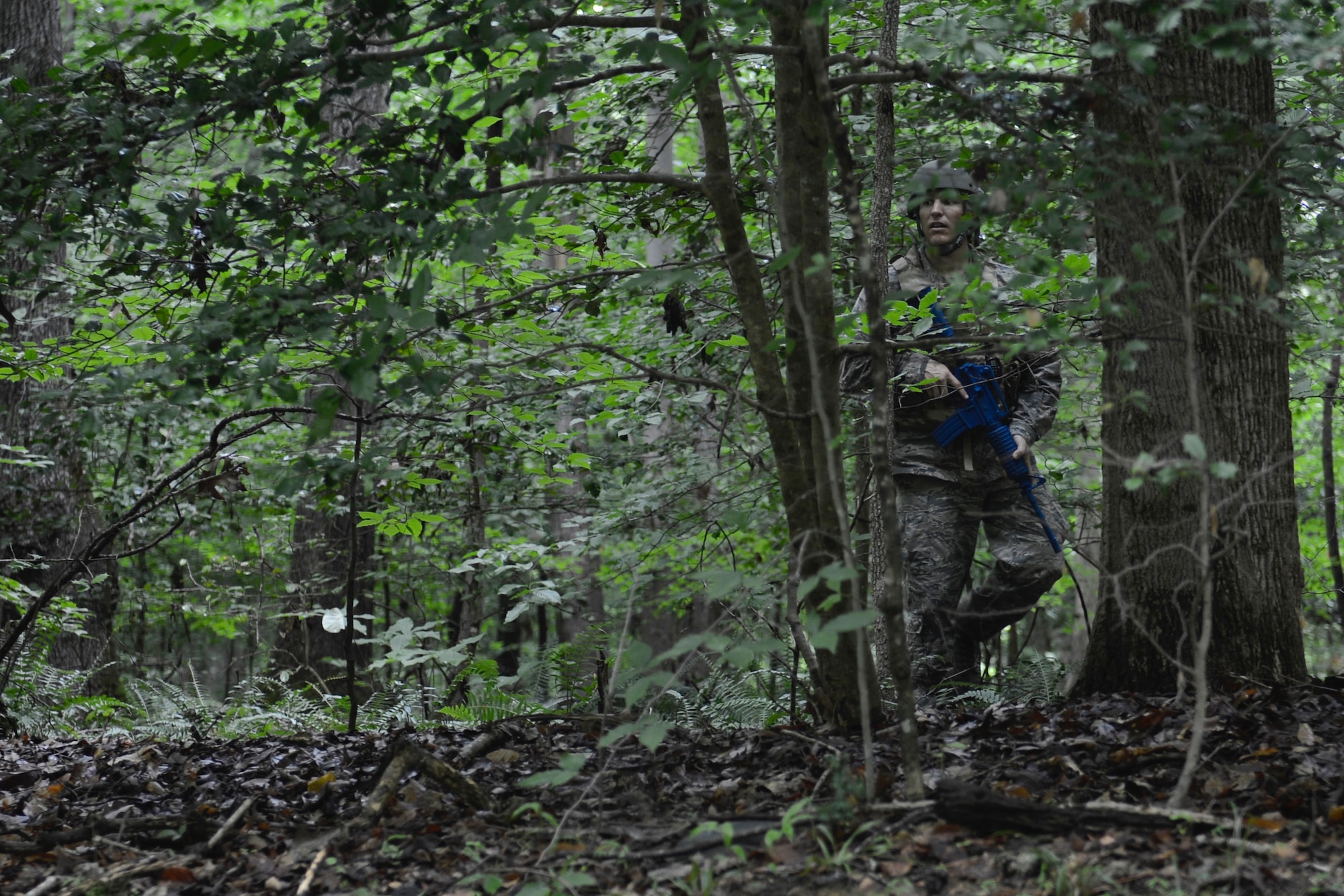 U.S. Air Force Tech. Sgt. Matthew Lawrence, below, 633rd Civil Engineer Squadron NCO of explosive ordnance device training, searches the woods for simulated improvised explosive devices during a Prime Base Engineer Emergency Force convoy training at Joint Base Langley-Eustis, Va., June 15, 2017. The goal of Prime BEEF training is for 633rd CES Airmen to gain deployment readiness skills, while also building morale among the different sections within the squadron. (U.S. Air Force photo/Airman 1st Class Kaylee Dubois)