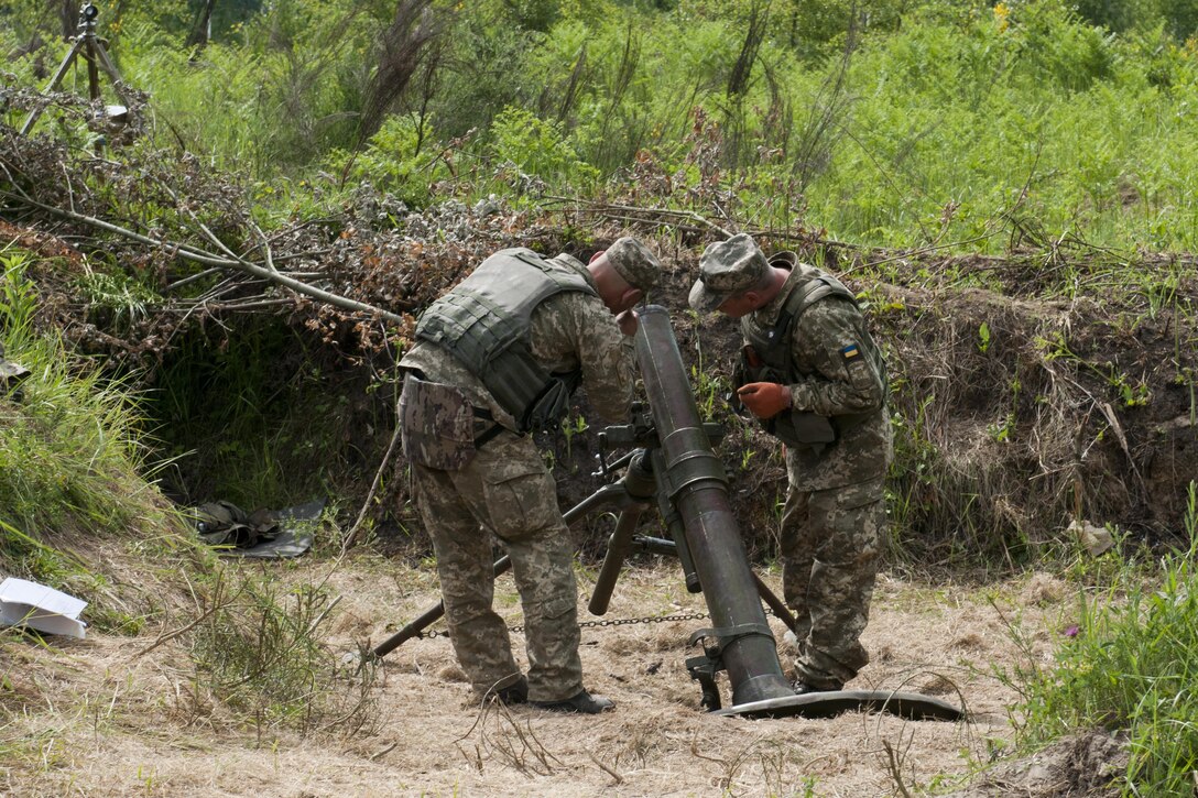 Ukrainian soldiers assigned to the 1st Airmobile Battalion, 79th Air Assault Brigade adjust a mortar’s trajectory during a live-fire exercise at the Yavoriv Combat Training Center at the International Peacekeeping and Security Center, near Yavoriv, Ukraine, June 16, 2017. Yavoriv CTC staff, along with mentors from the Oklahoma Army National Guard's 45th Infantry Brigade Combat Team, led the training for soldiers from the 1-79th during the battalion's rotation through the Yavoriv CTC. The 45th is deployed to Ukraine as part of the Joint Multinational Training Group-Ukraine, an international coalition dedicated to improving the CTC's training capacity and building professionalism within the Ukrainian army. Army photo by Staff Sgt. Eric McDonough
