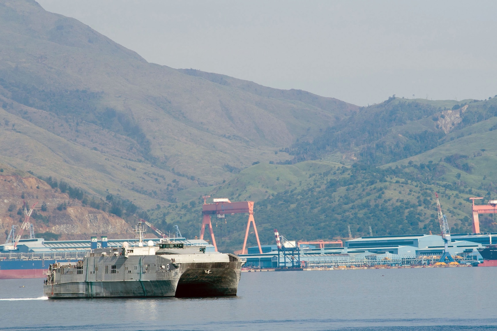 The Spearhead-class joint high speed vessel USNS Millinocket (JHSV 3) transits Subic Bay behind the Arleigh Burke-class guided-missile destroyer USS Sterett (DDG 104), June 18, 2017. Sterett is part of the Sterett-Dewey Surface Action Group and is the third deploying group operating under the command and control construct called 3rd Fleet Forward.