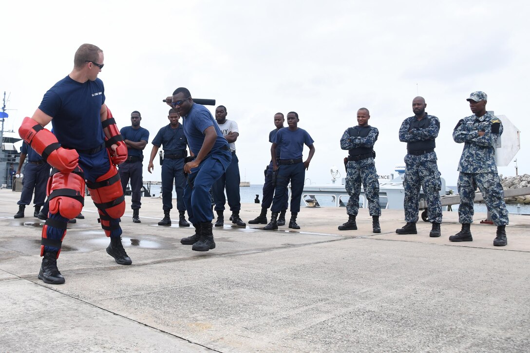 Coast Guard Petty Officer First Class Brett Doherty, a maritime enforcement specialist, gives law enforcement training to partner nation participants of Tradewinds 2017 at the Barbados Coast Guard Base in Bridgetown, Barbados, June 9, 2017. 